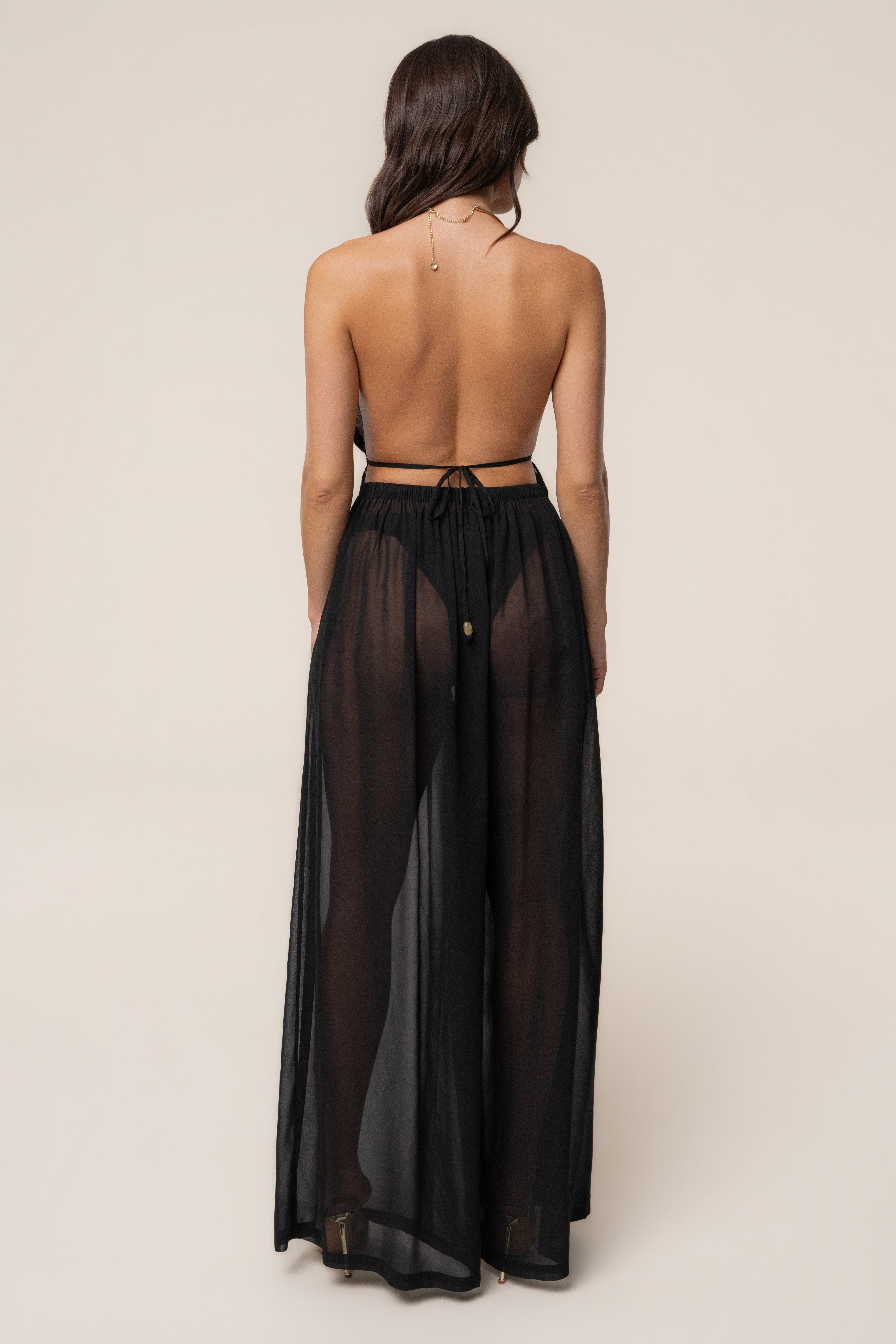 Black resort glow chiffon pants by JLUXLABEL, featuring flowy fabric and relaxed fit, perfect for summer or resort wear.