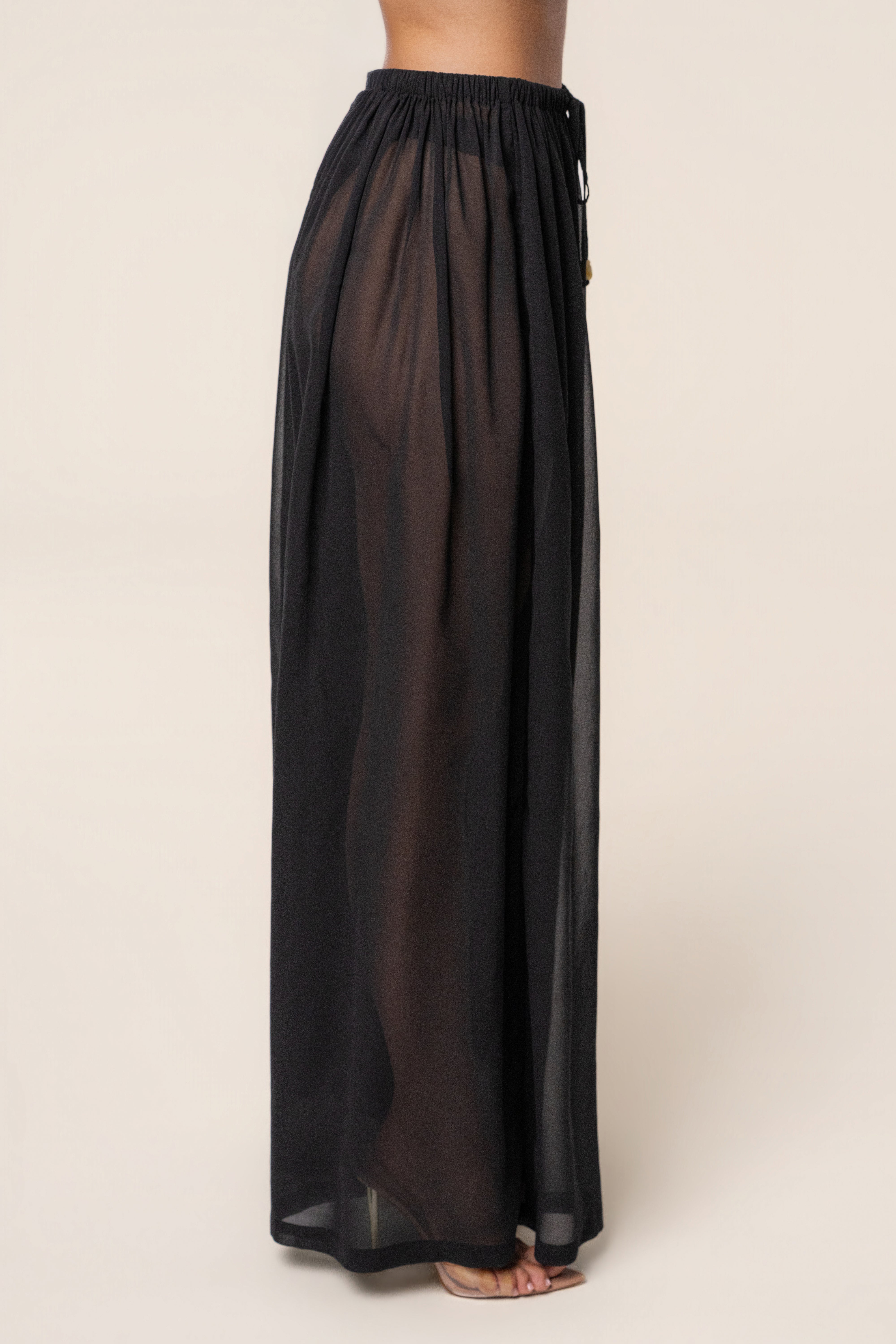 Black chiffon pant from JLUXLABEL's Resort Glow collection, featuring flowy, lightweight fabric and relaxed fit bottoms.
