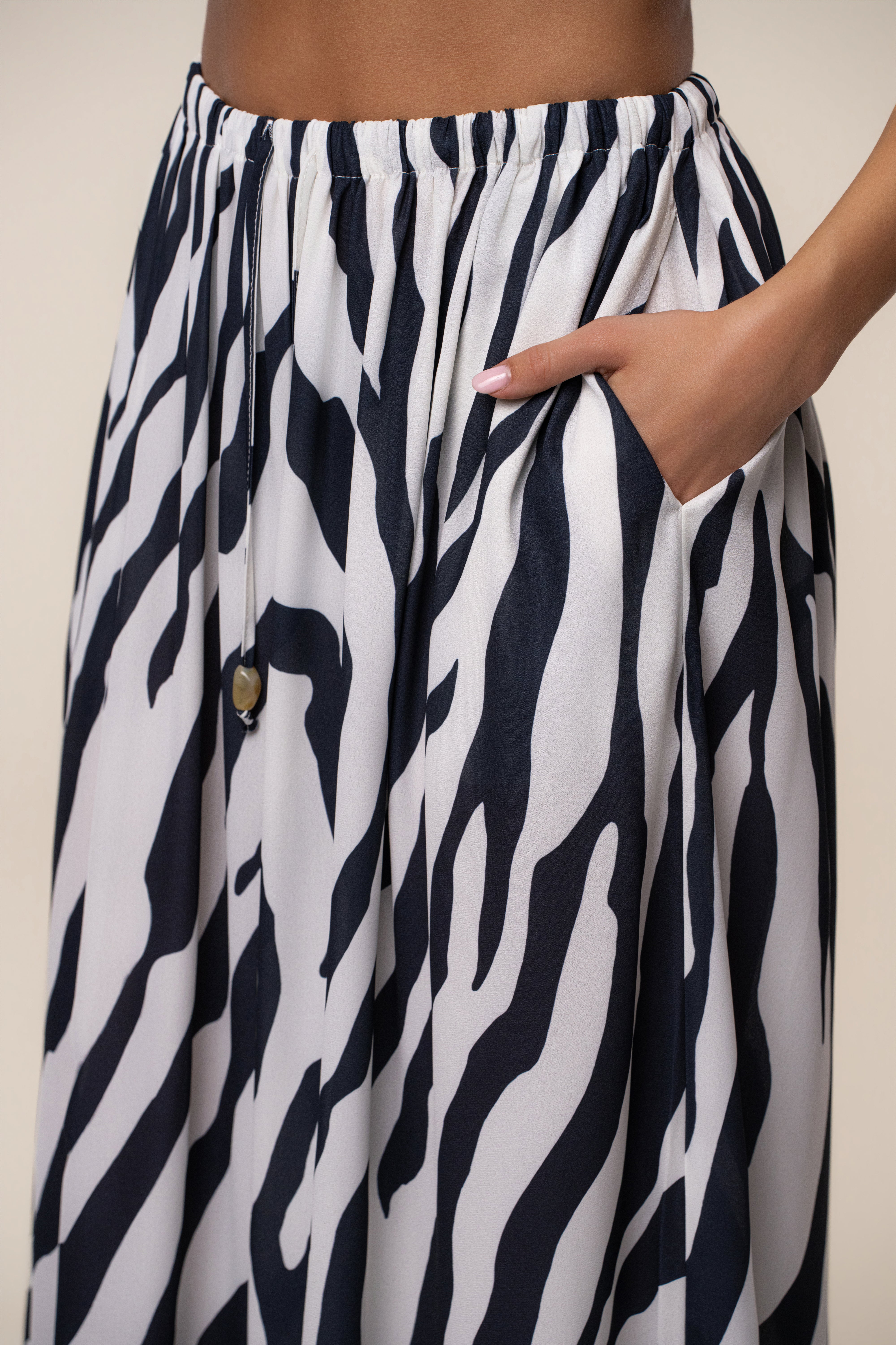 Navy zebra print chiffon pant from JLUXLABEL's resort glow collection, featuring flowy, lightweight bottoms with a relaxed fit.
