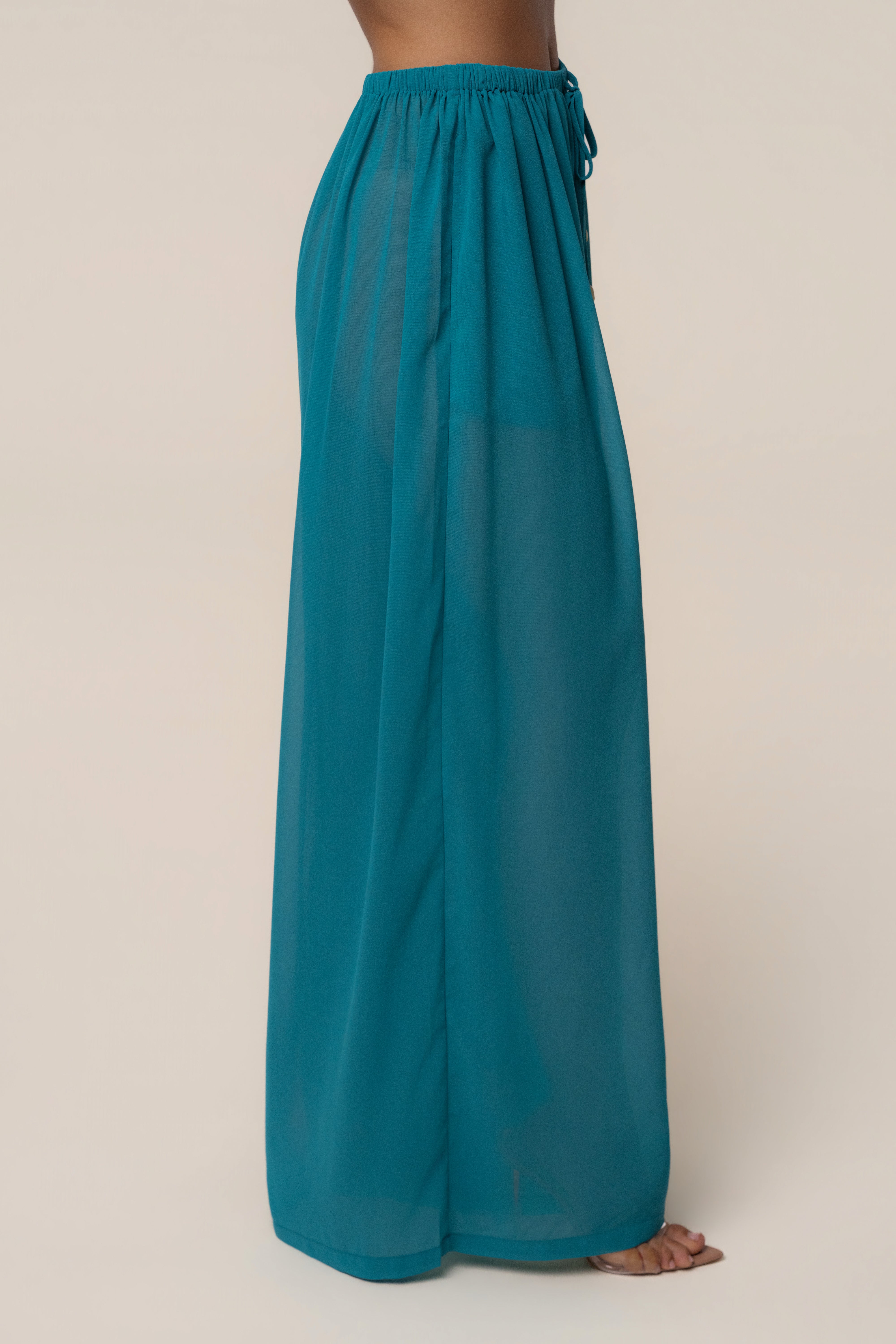 Light blue chiffon pant from JLUXLABEL Aqua Resort Glow collection, featuring flowy, lightweight fabric and relaxed fit bottoms.