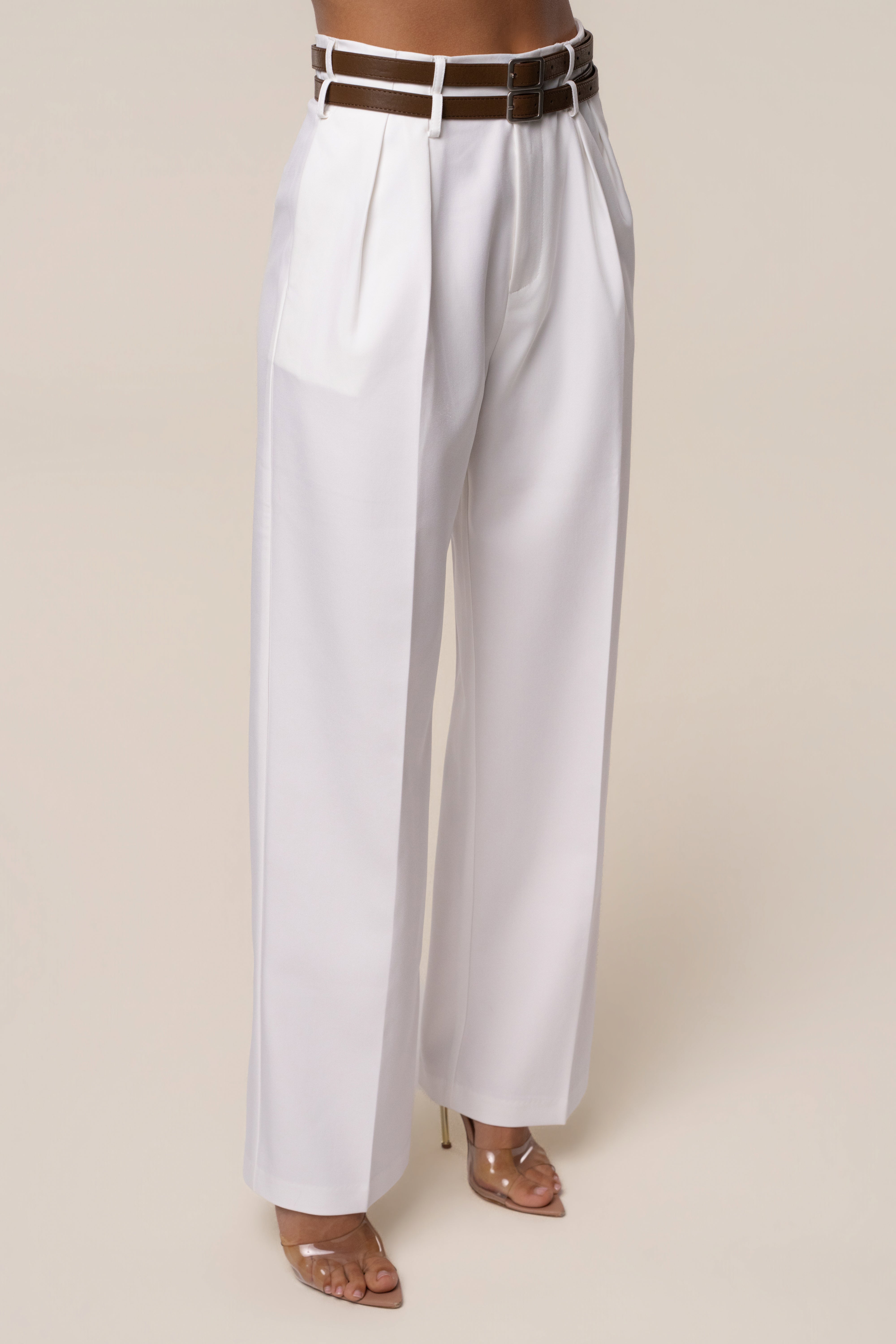Ivory modern belted trousers from JLUXLABEL, stylish bottoms with a sleek fit and wide waistband, ideal for contemporary fashion.
