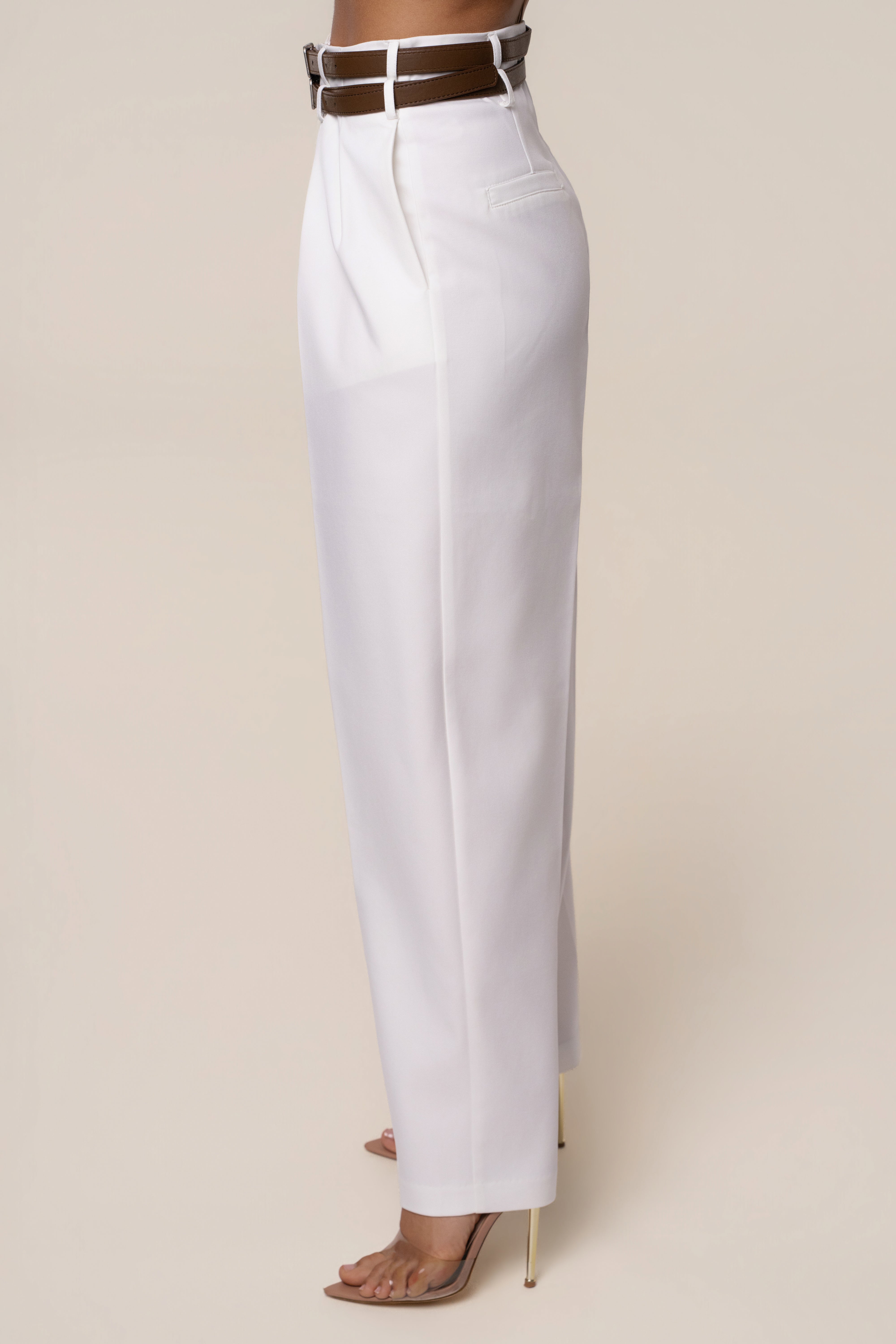 Ivory modern belted trousers by JLUXLABEL for women, featuring a sleek design and tailored fit, perfect for stylish bottoms.