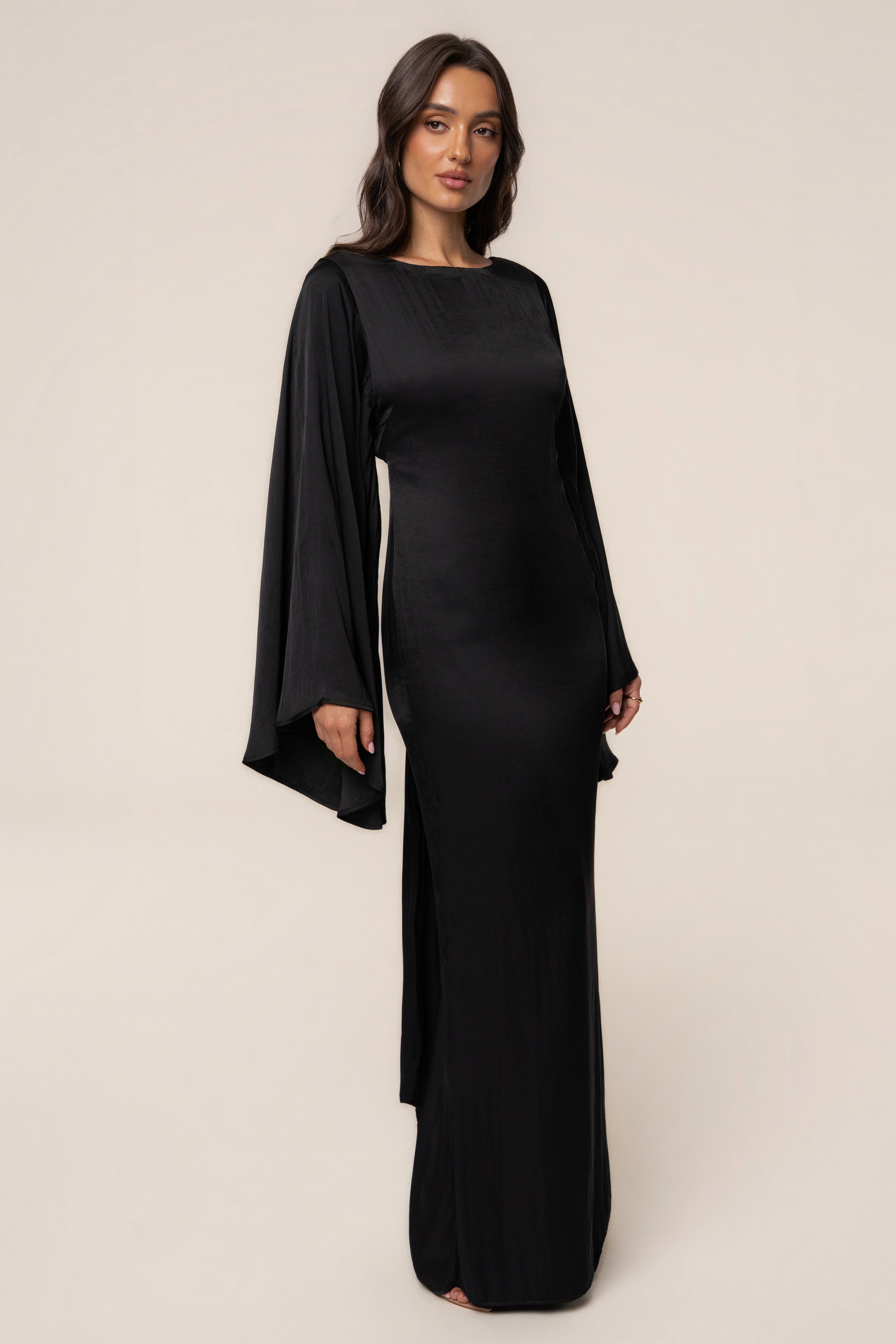 Black soft fabric maxi dress by JLUXLABEL featuring a flowing silhouette and elegant design.
