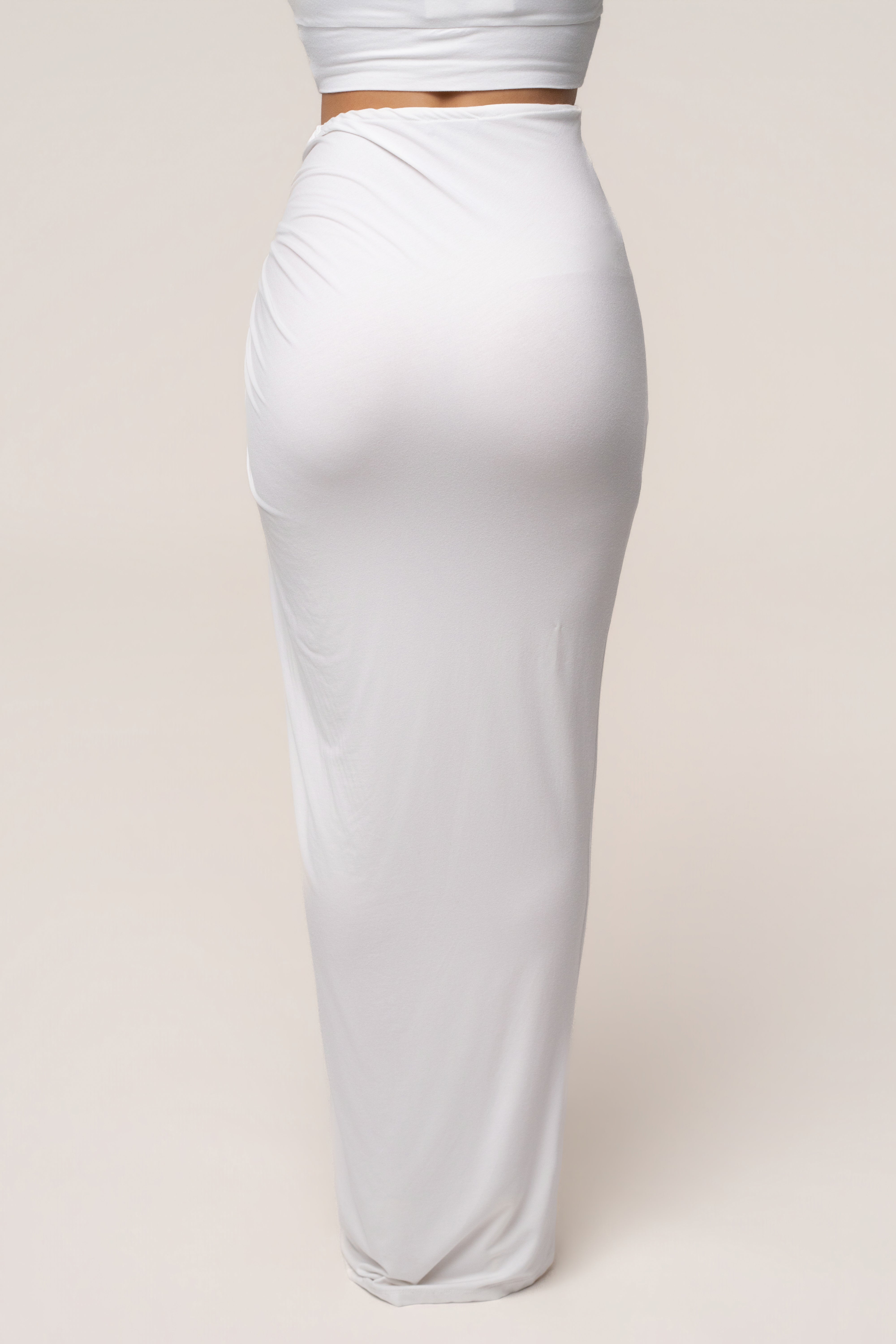 White Island Drape Maxi Skirt by JLUXLABEL featuring flowing fabric and a high waist, perfect for elegant summer looks.