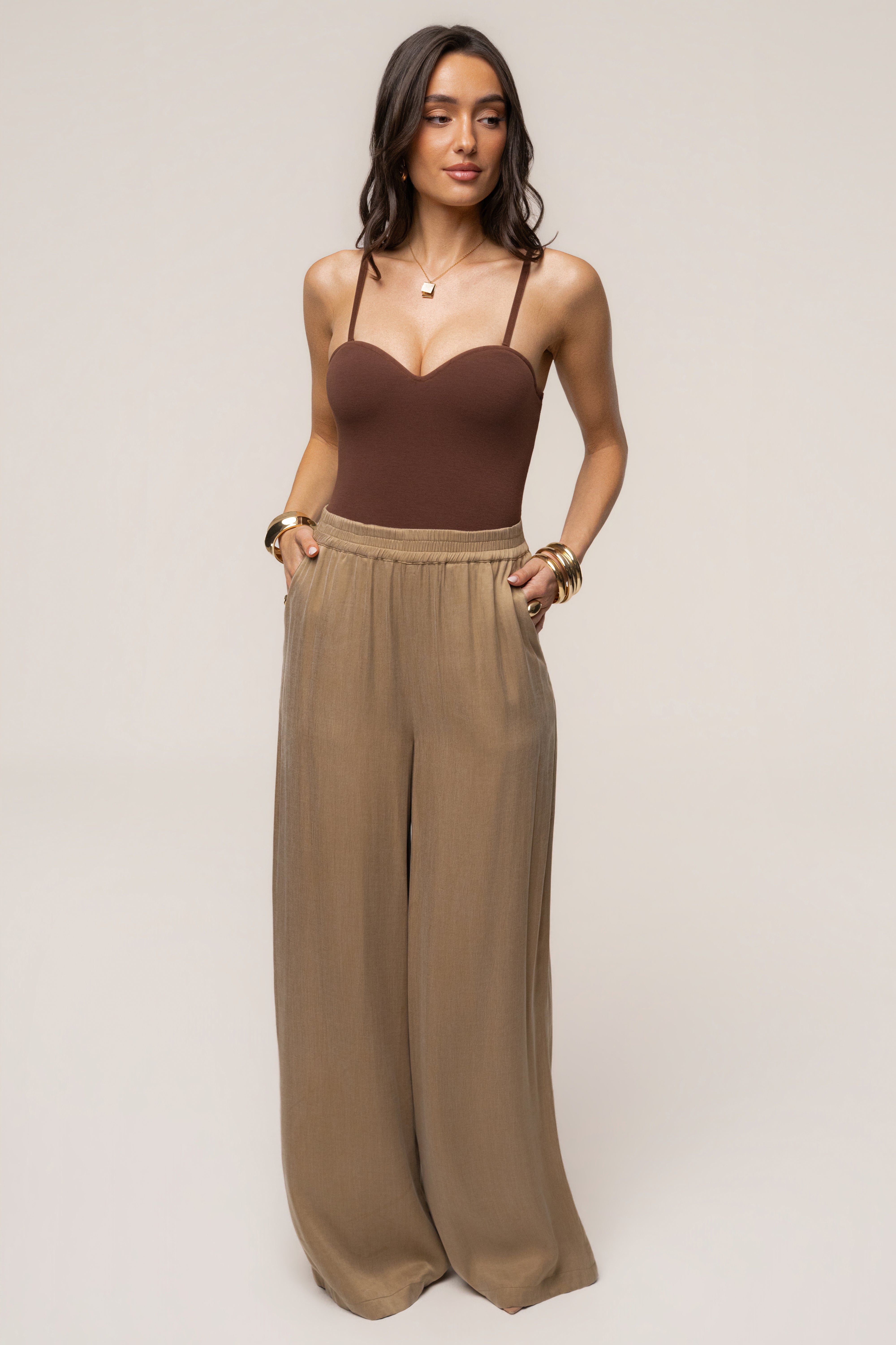 Chocolate JLUXLABEL Sascha strapless bodysuit, stylish women's top with a fitted design, shown on a model.