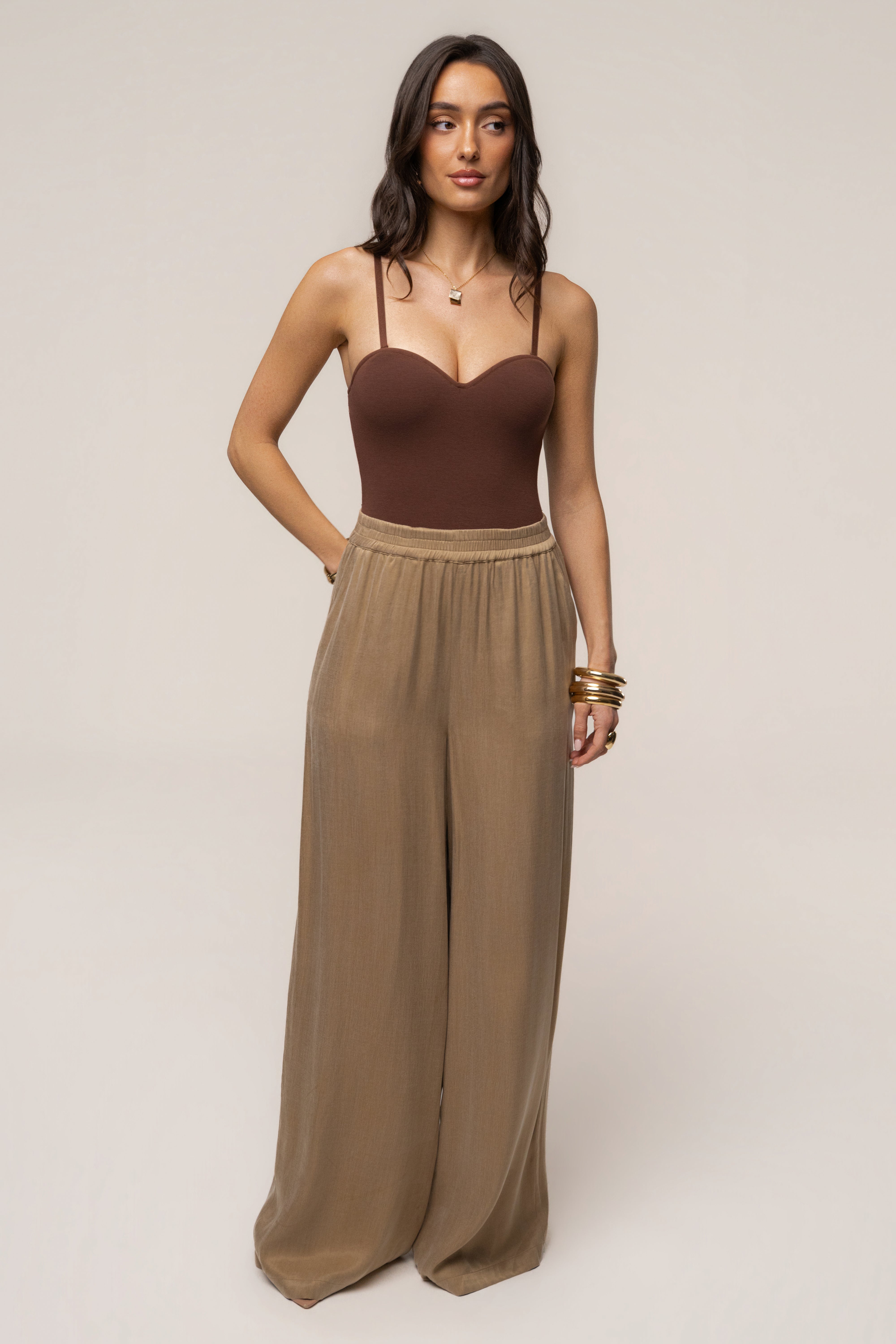 JLUXLABEL chocolate Sascha strapless bodysuit, stylish top with smooth fabric and fitted design, displayed on a hanger.