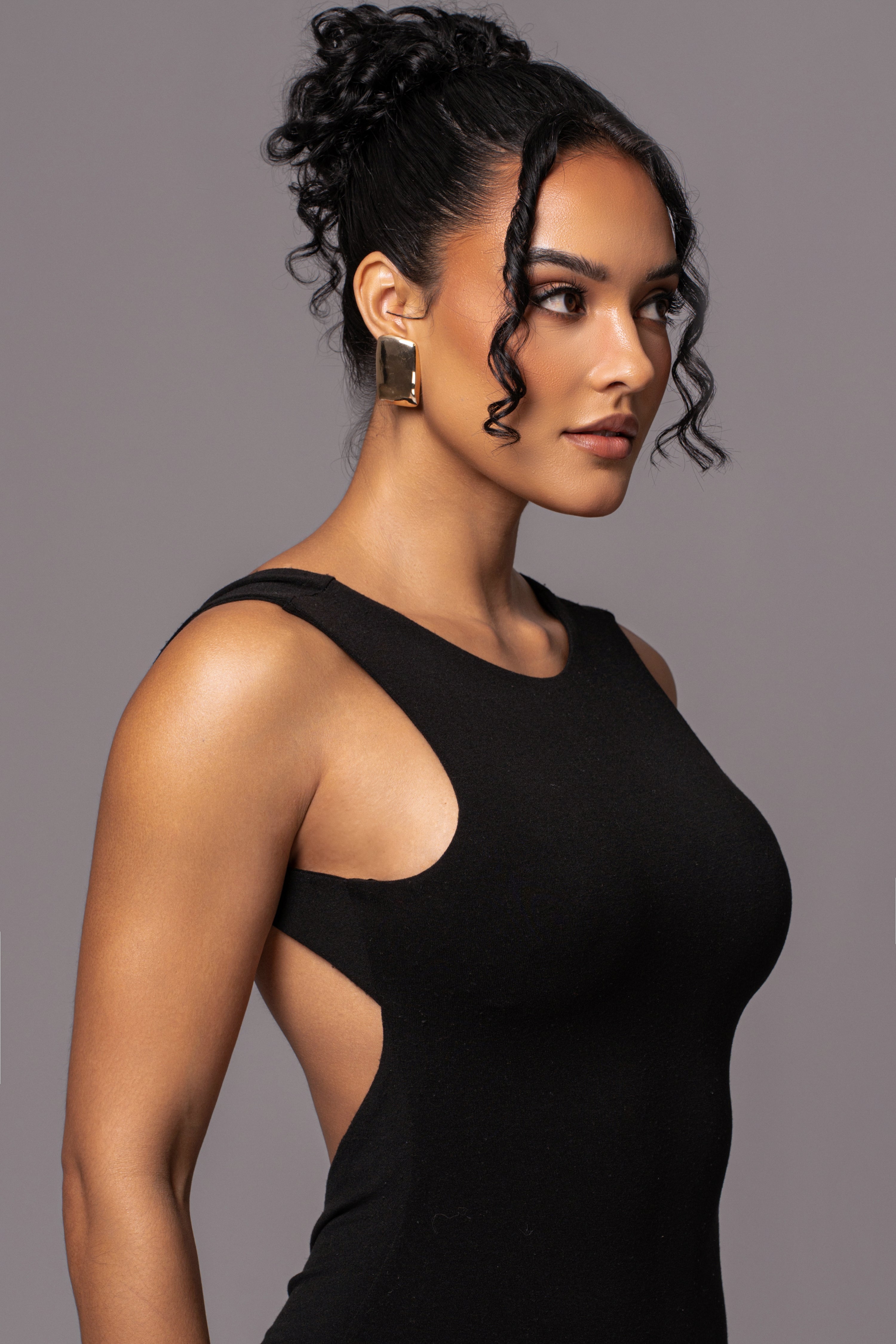 Black JLUXBASIX front and center maxi dress with a flowing silhouette, sleeveless design, and elegant style from JLUXLABEL.