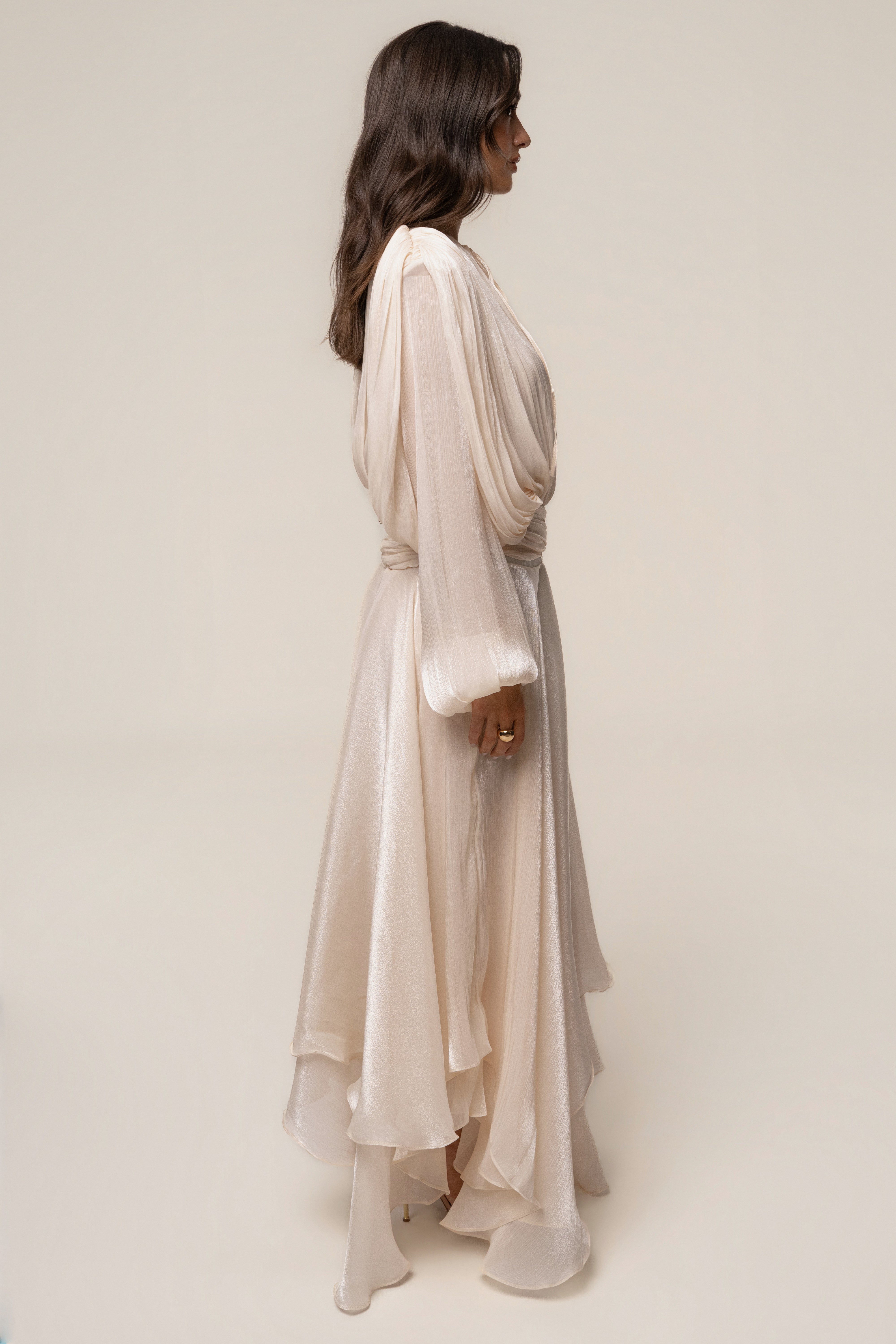 Cream draped maxi dress by JLUXLABEL featuring elegant, flowing fabric and a sophisticated design for formal occasions.