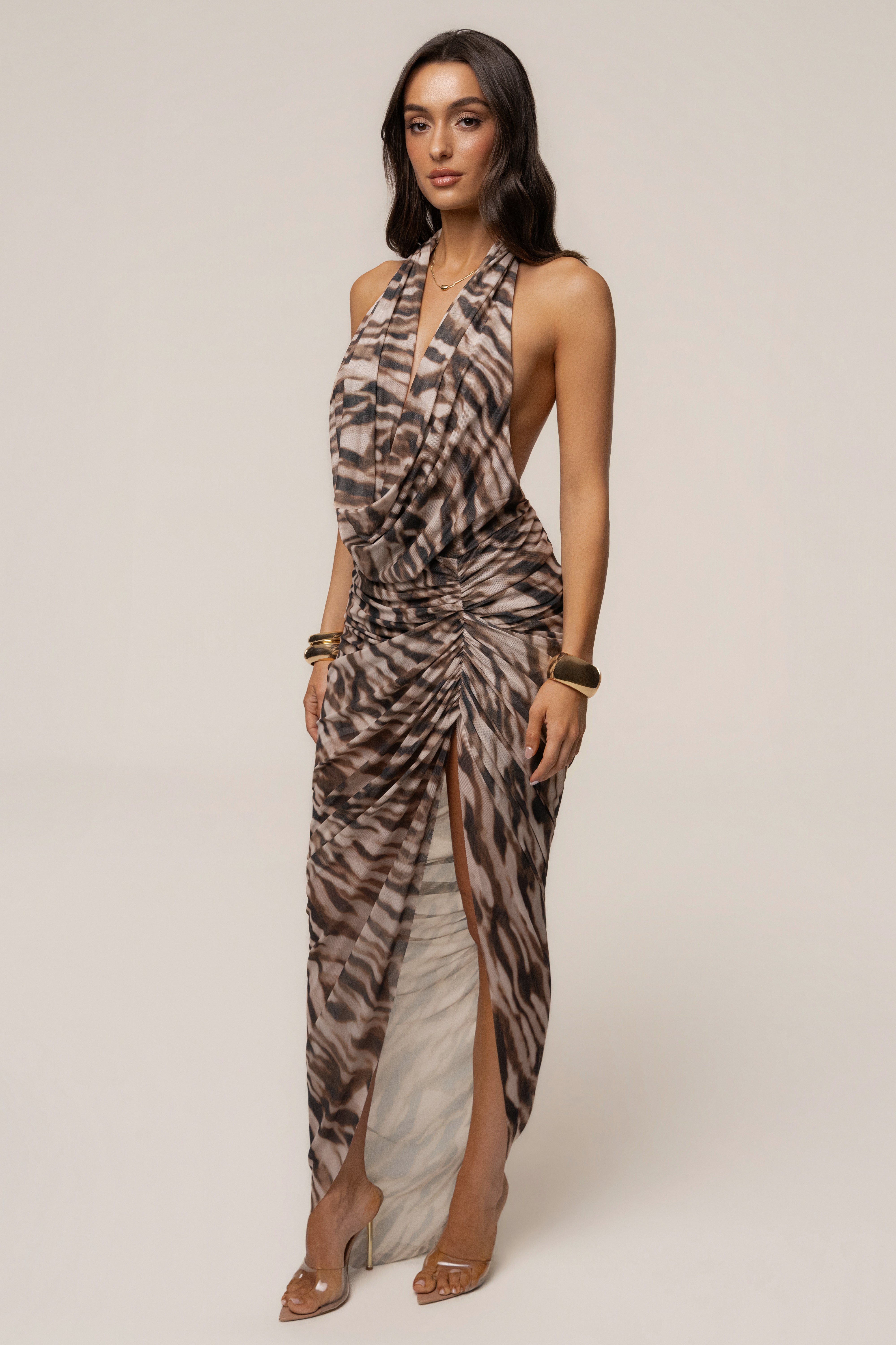 Brown Zebra Ariana plunge halter dress by JLUXLABEL featuring a bold zebra print and a stylish plunging neckline.