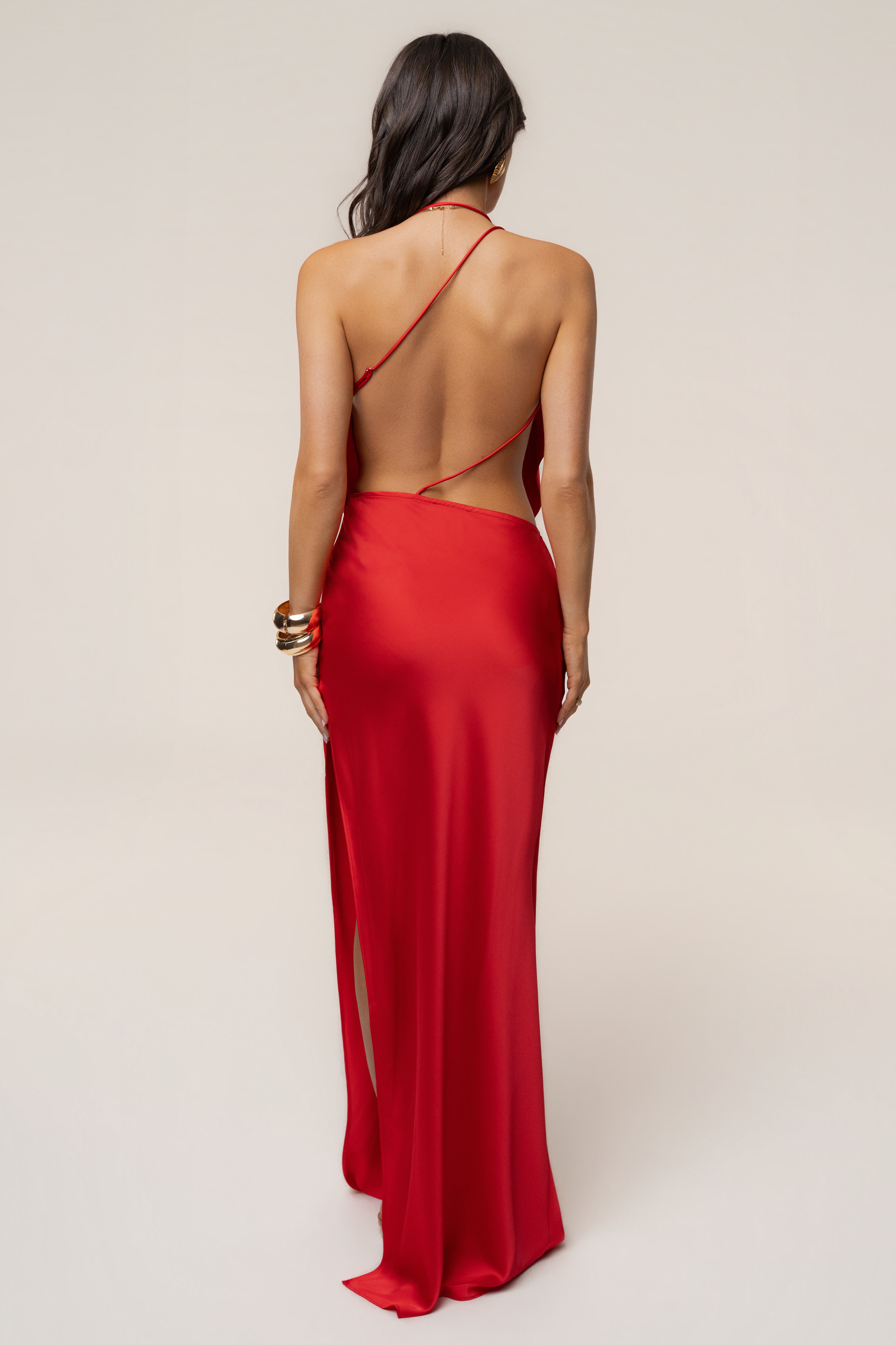 Back view of Tangerine Delmara Cowl Maxi Dress with thin crisscross straps and open back.
