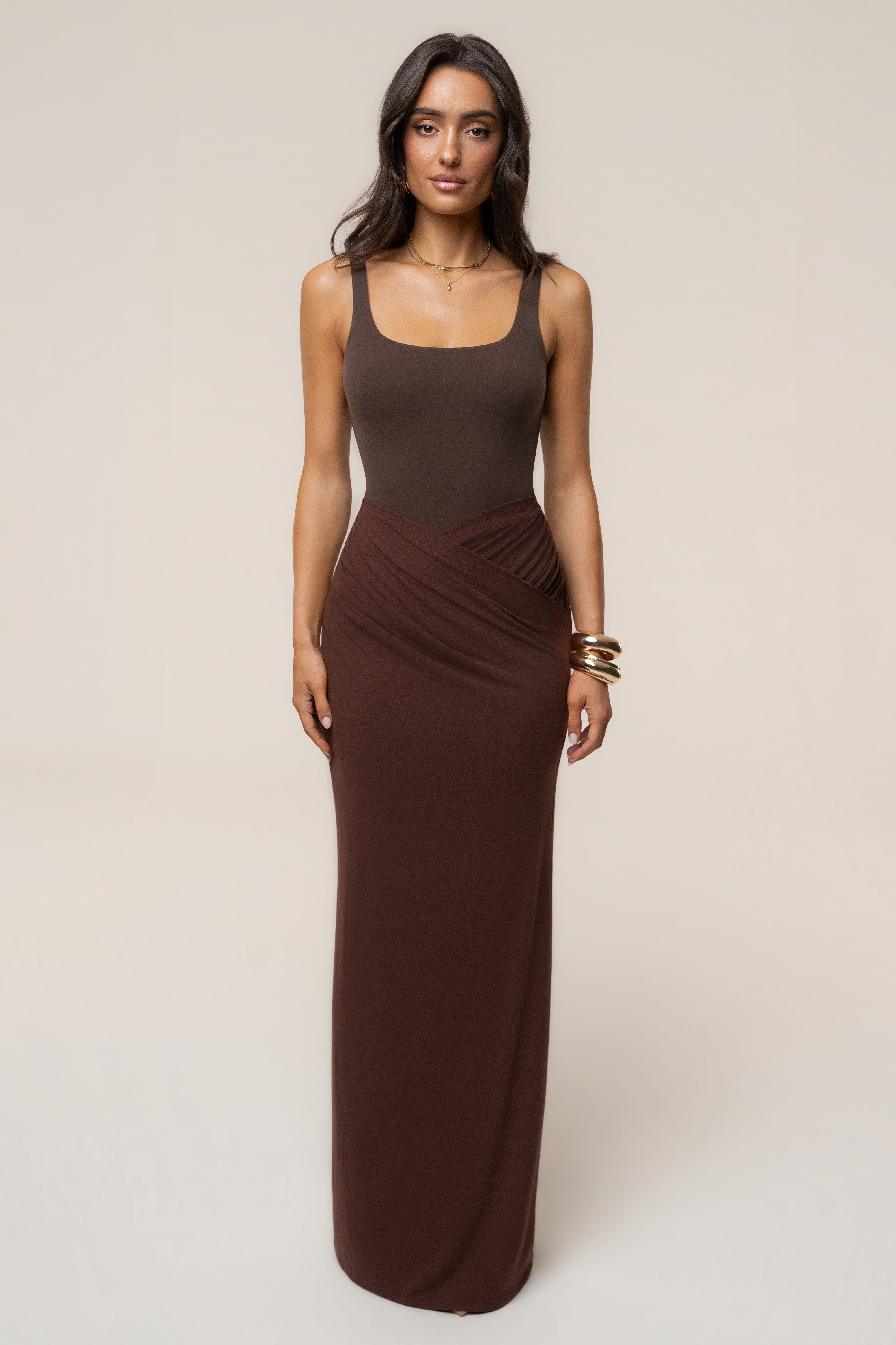 Chocolate Passion Maxi Skirt by JLUXLABEL featuring flowy fabric and a high waist, styled for a chic, casual look.