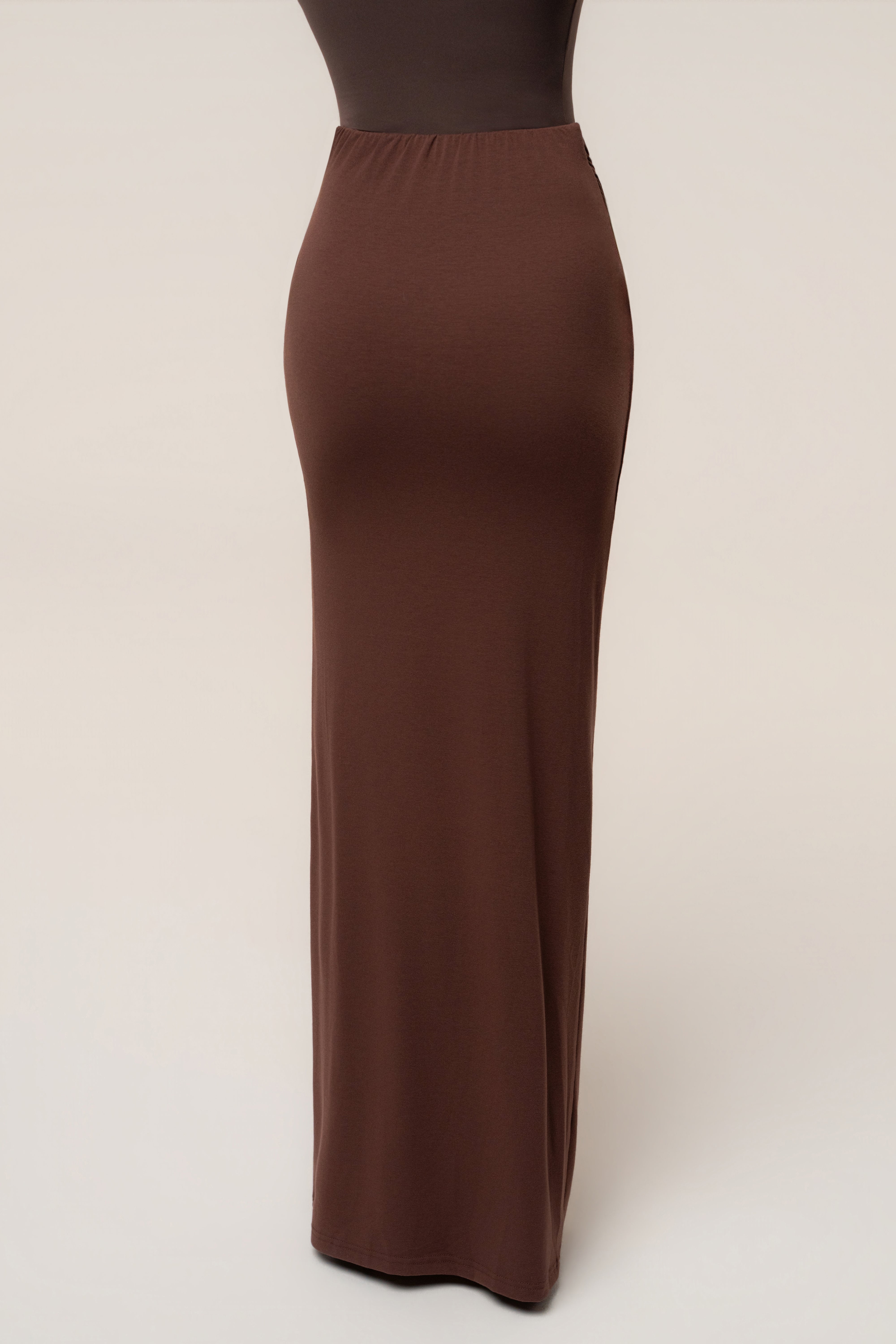 Chocolate Passion Maxi Skirt from JLUXLABEL, flowing brown bottoms with a high waist and elegant design, displayed on a model.
