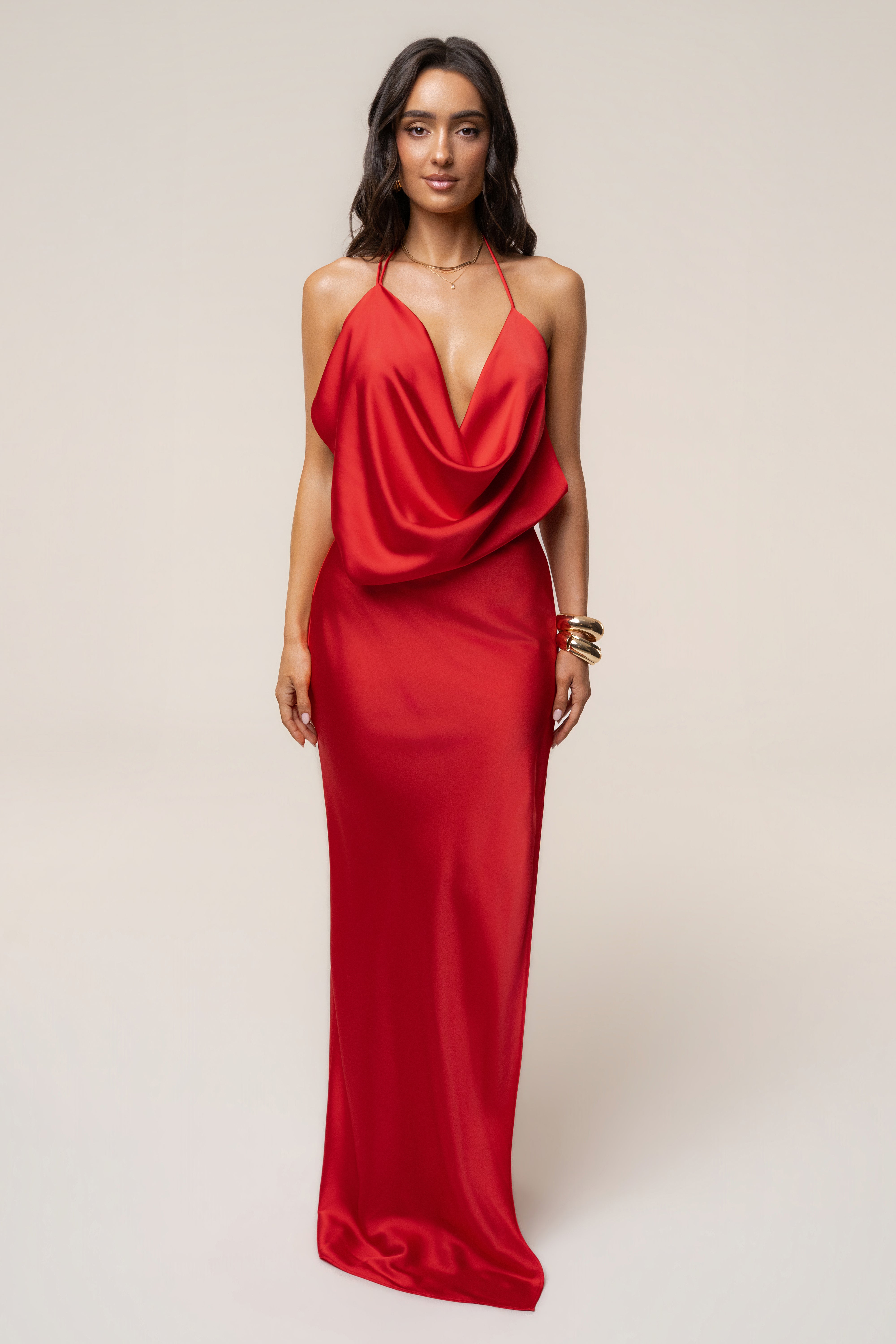 Full-length view of a woman in a Tangerine Delmara Cowl Maxi Dress with a thigh-high slit.