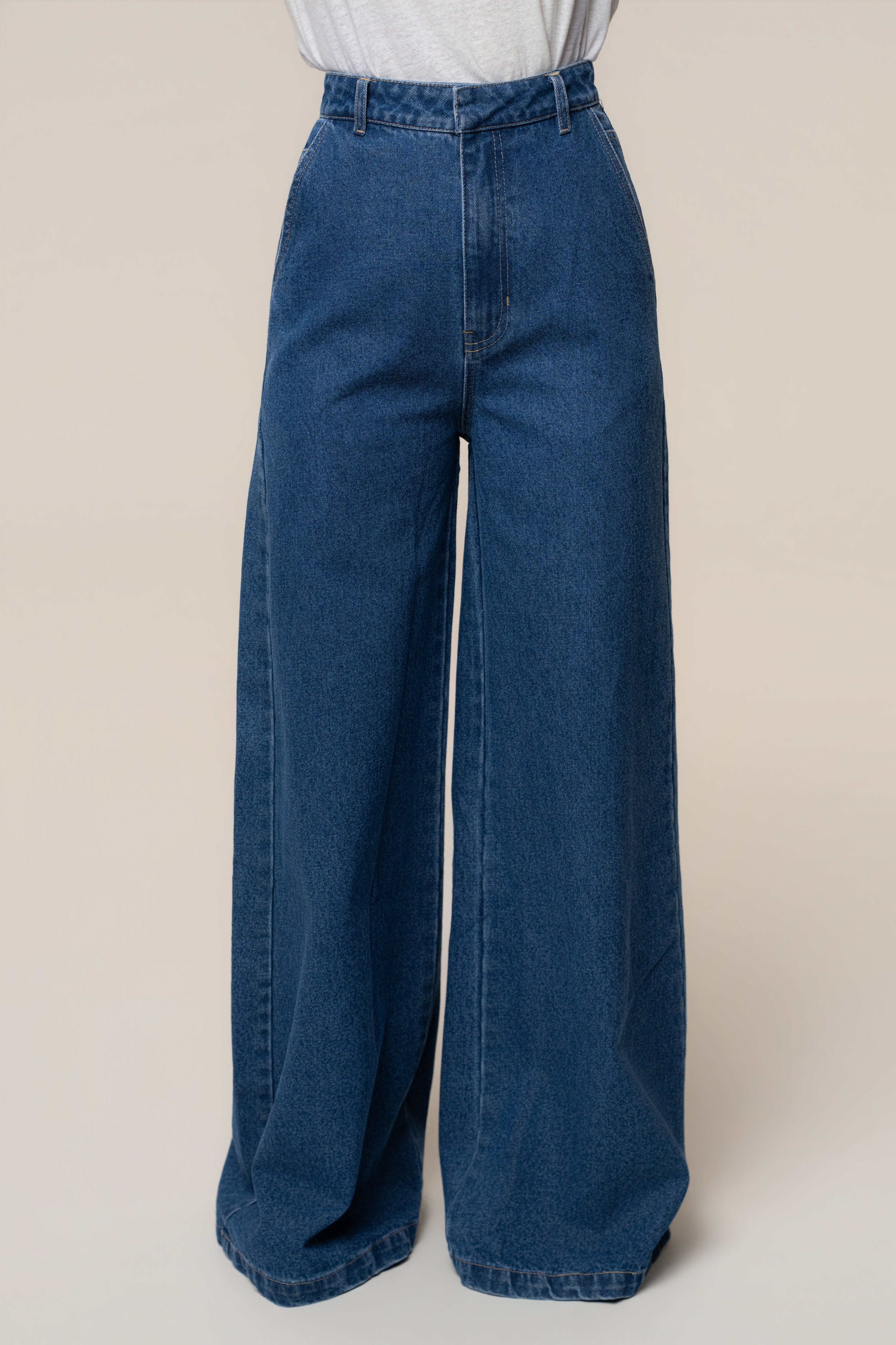 Medium wash wide leg denim jeans with high waist and visible belt loops