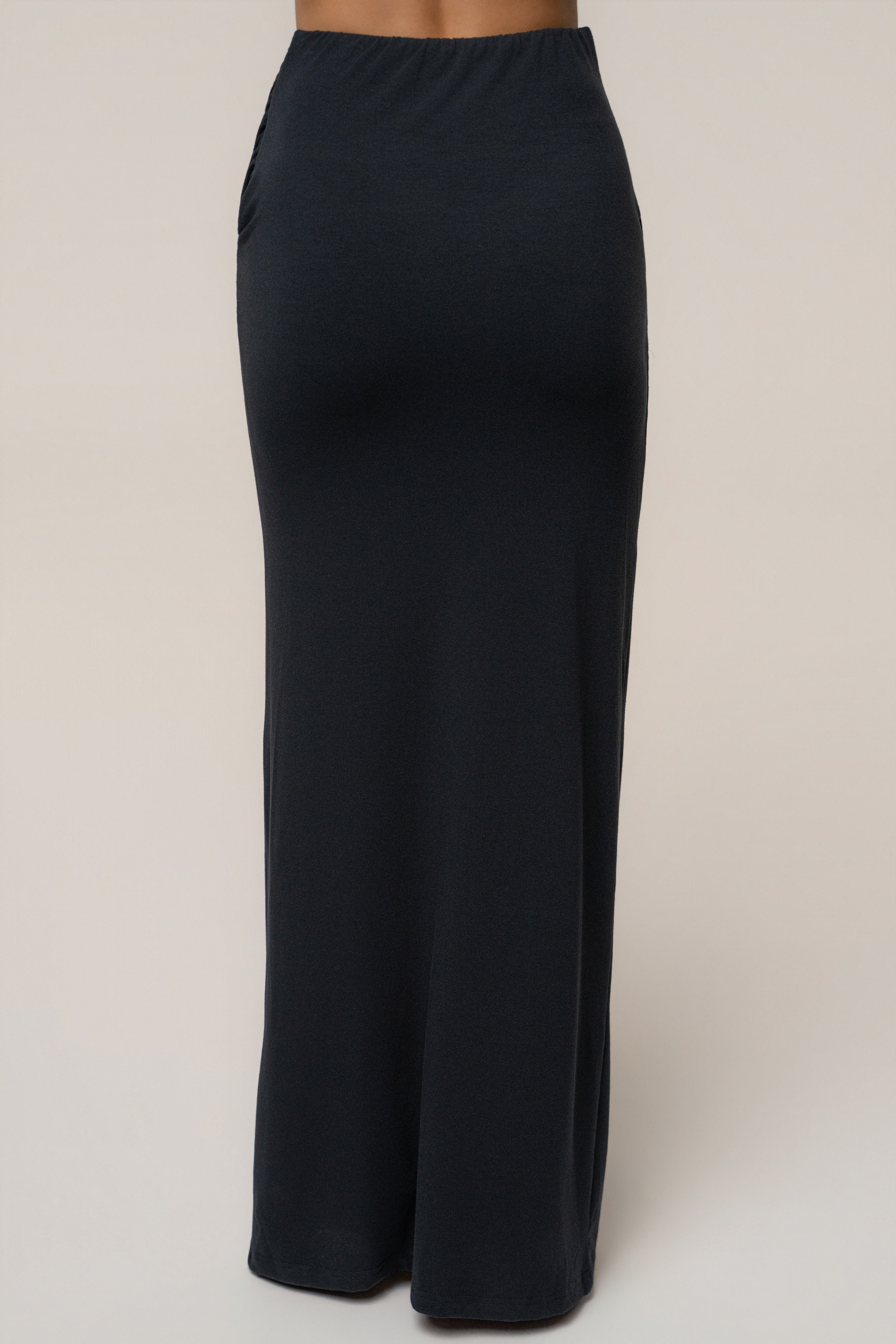 Back view of Black Passion Maxi Skirt with elastic waistband and long flowing hem