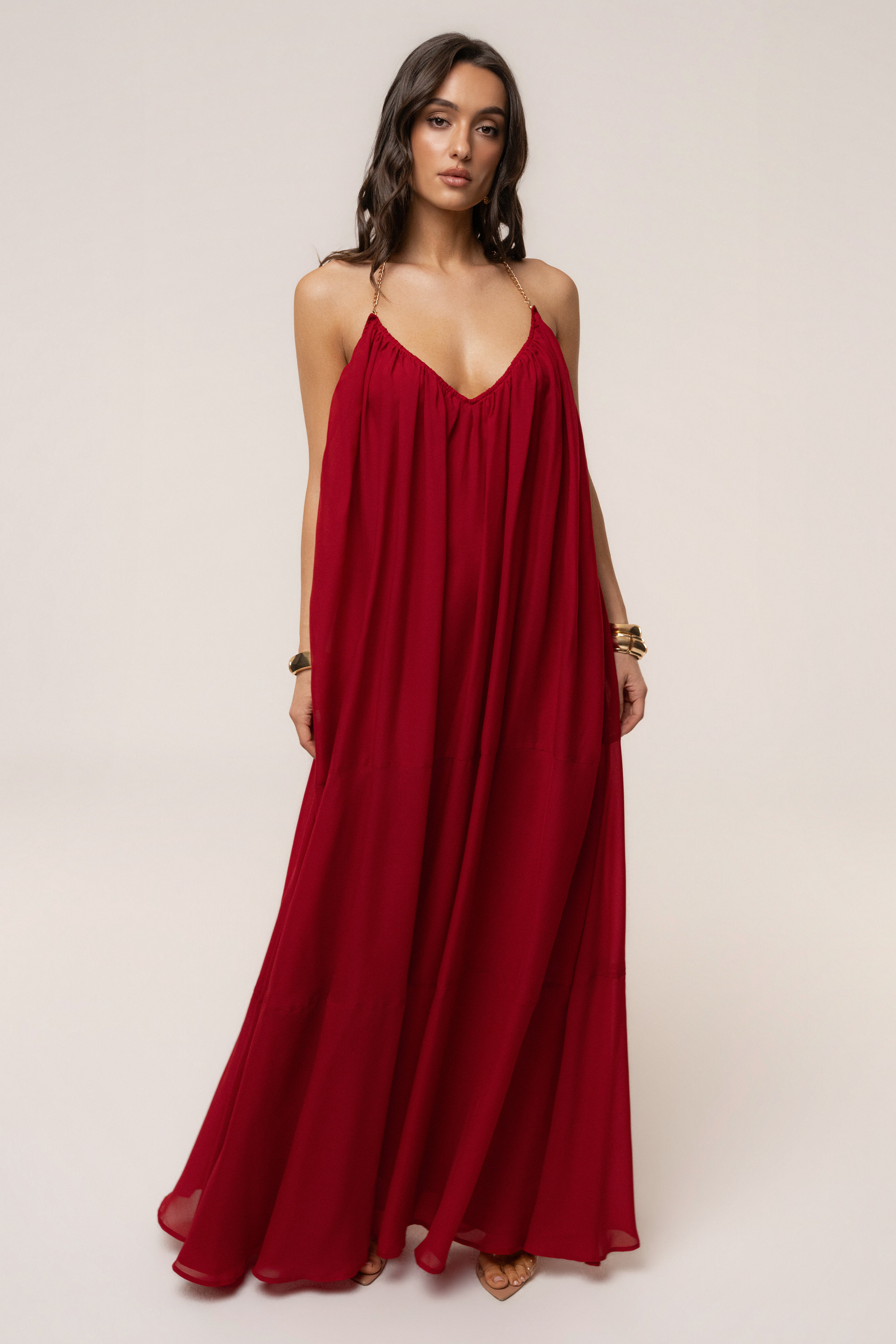 Red Hana backless maxi dress by JLUXLABEL, flowing fabric with a deep back design, perfect for elegant summer occasions.