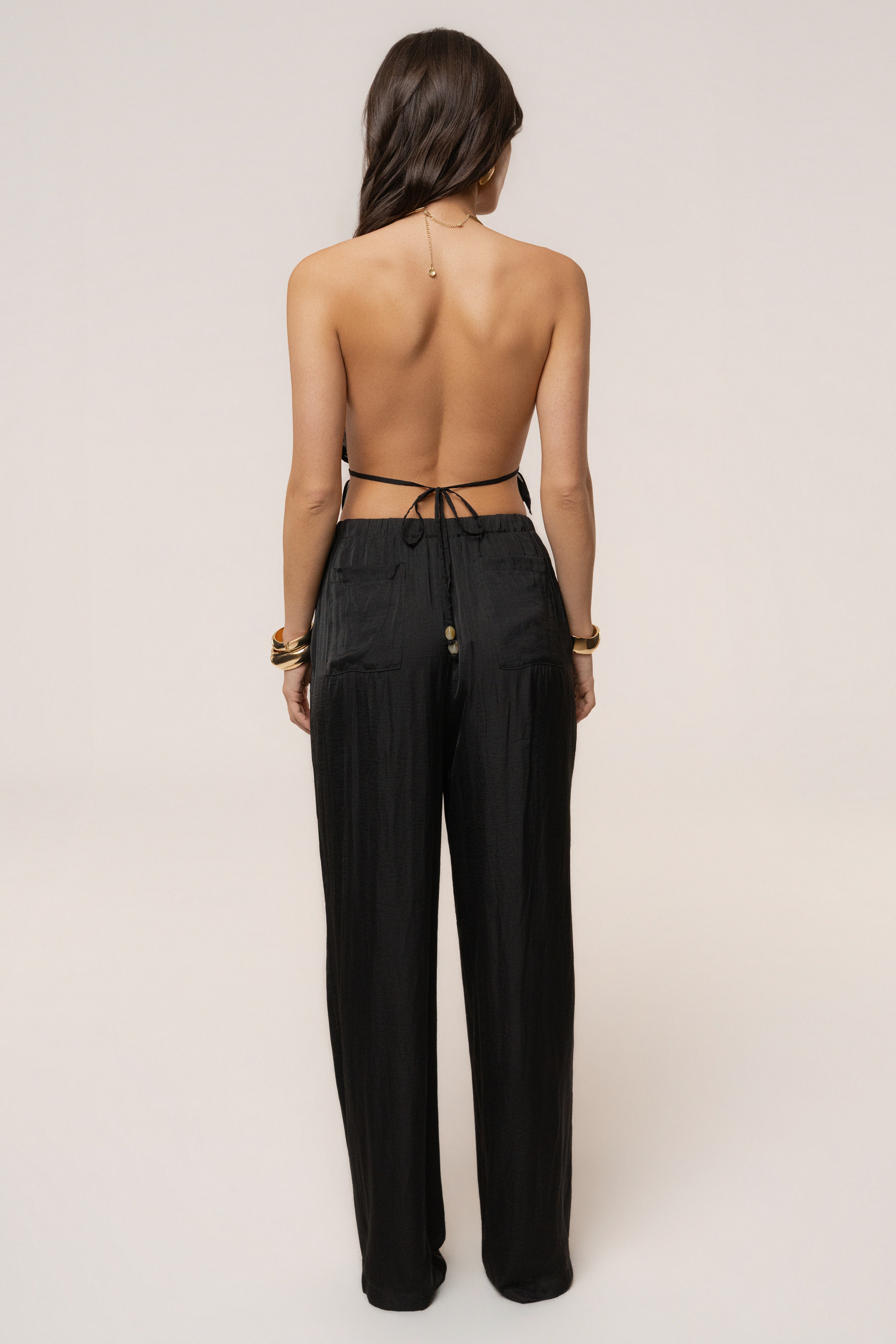 Black Moonlit Coast halter top by JLUXLABEL featuring a stylish design and adjustable straps, perfect for trendy summer outfits.
