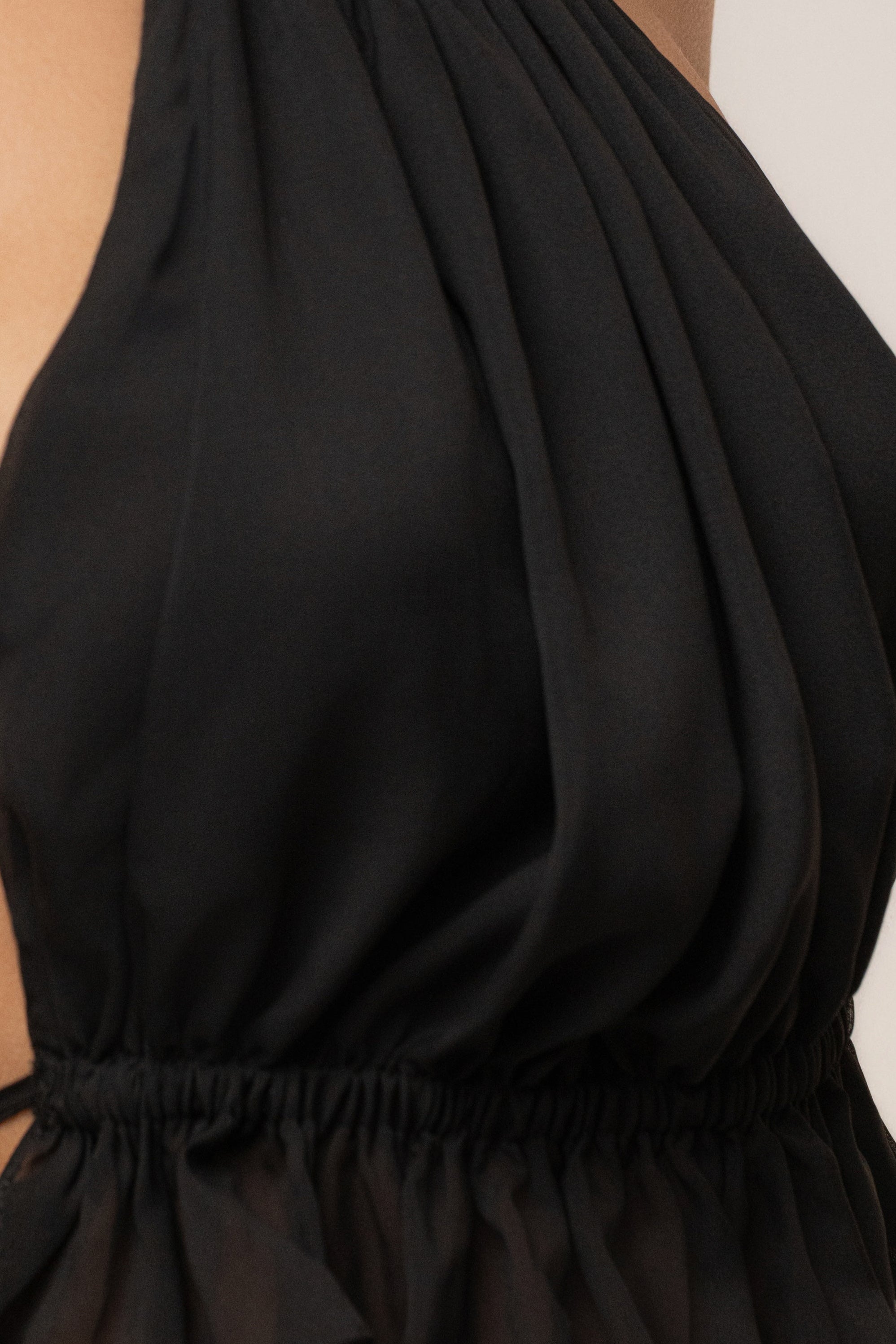 Black Moonlit Coast halter top by JLUXLABEL, featuring a stylish design with a halter neckline and smooth fabric.