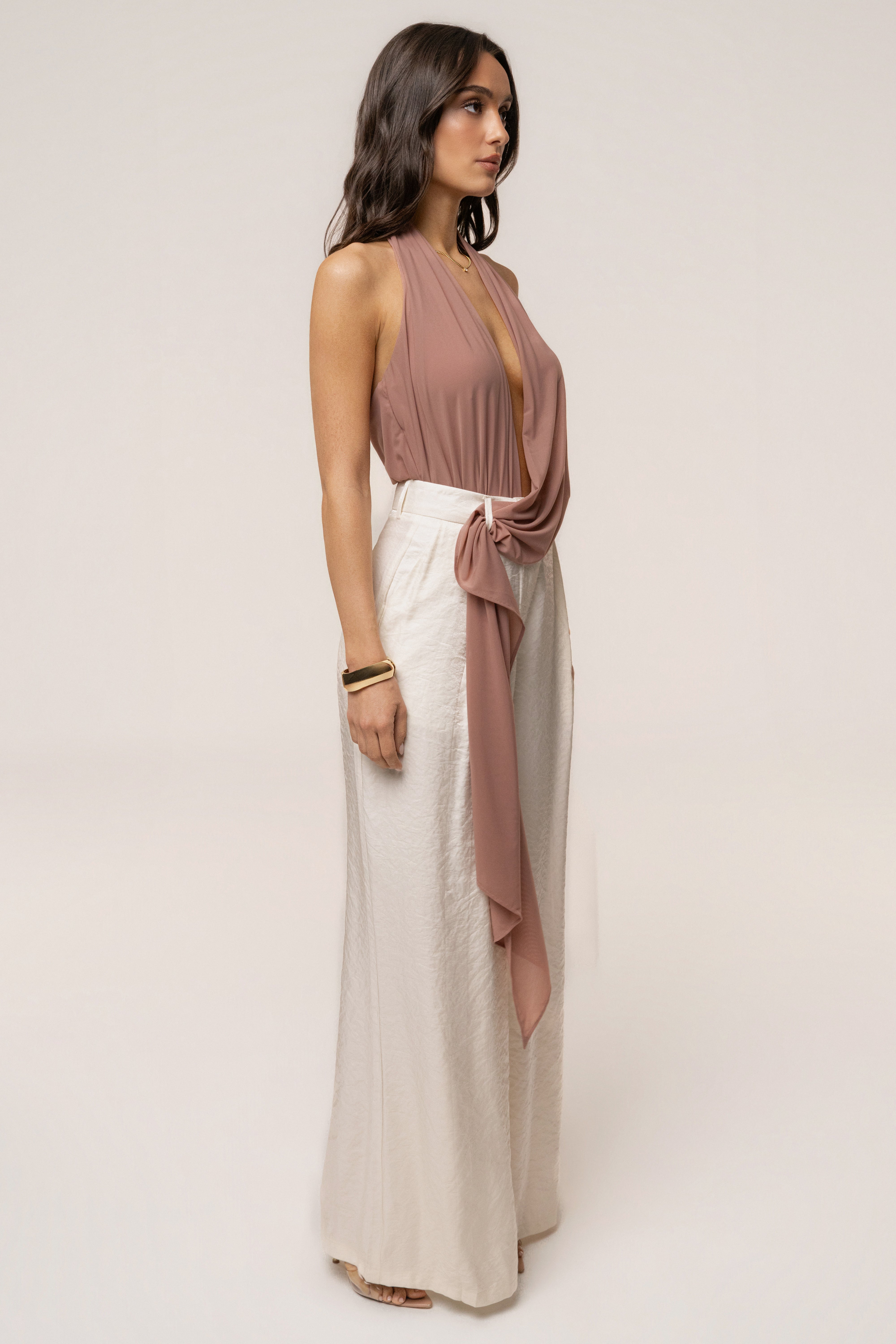 Dusty Rose JLUXLABEL Bare Form plunge bodysuit, stylish top with deep V neckline and fitted design, shown on a model.