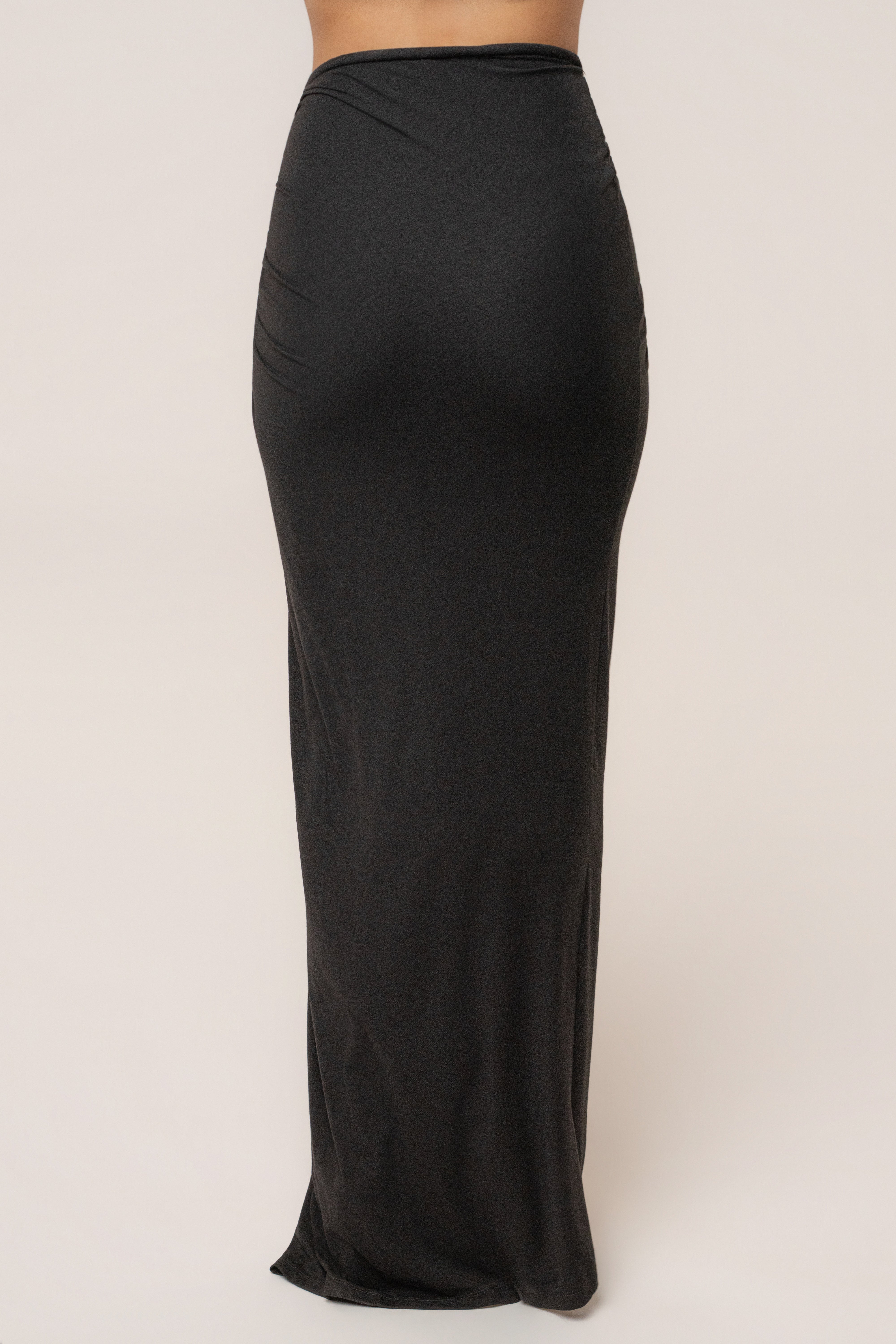 Black Island Drape Maxi Skirt by JLUXLABEL featuring flowing fabric and draped design, full-length bottom for elegant style.