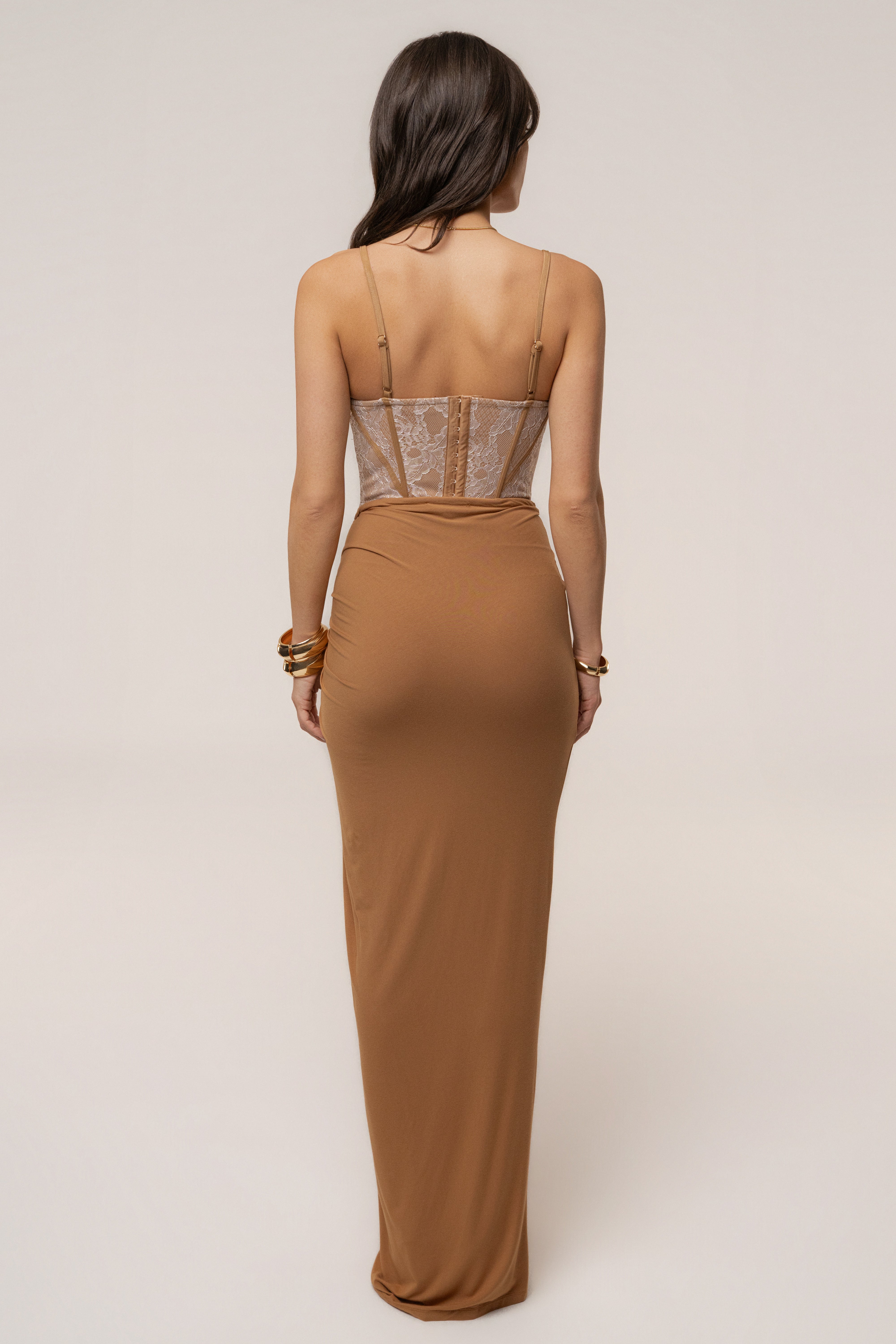 Tan JLUXLABEL Island Drape Maxi Skirt, flowing bottoms with draped design, shown on a model.