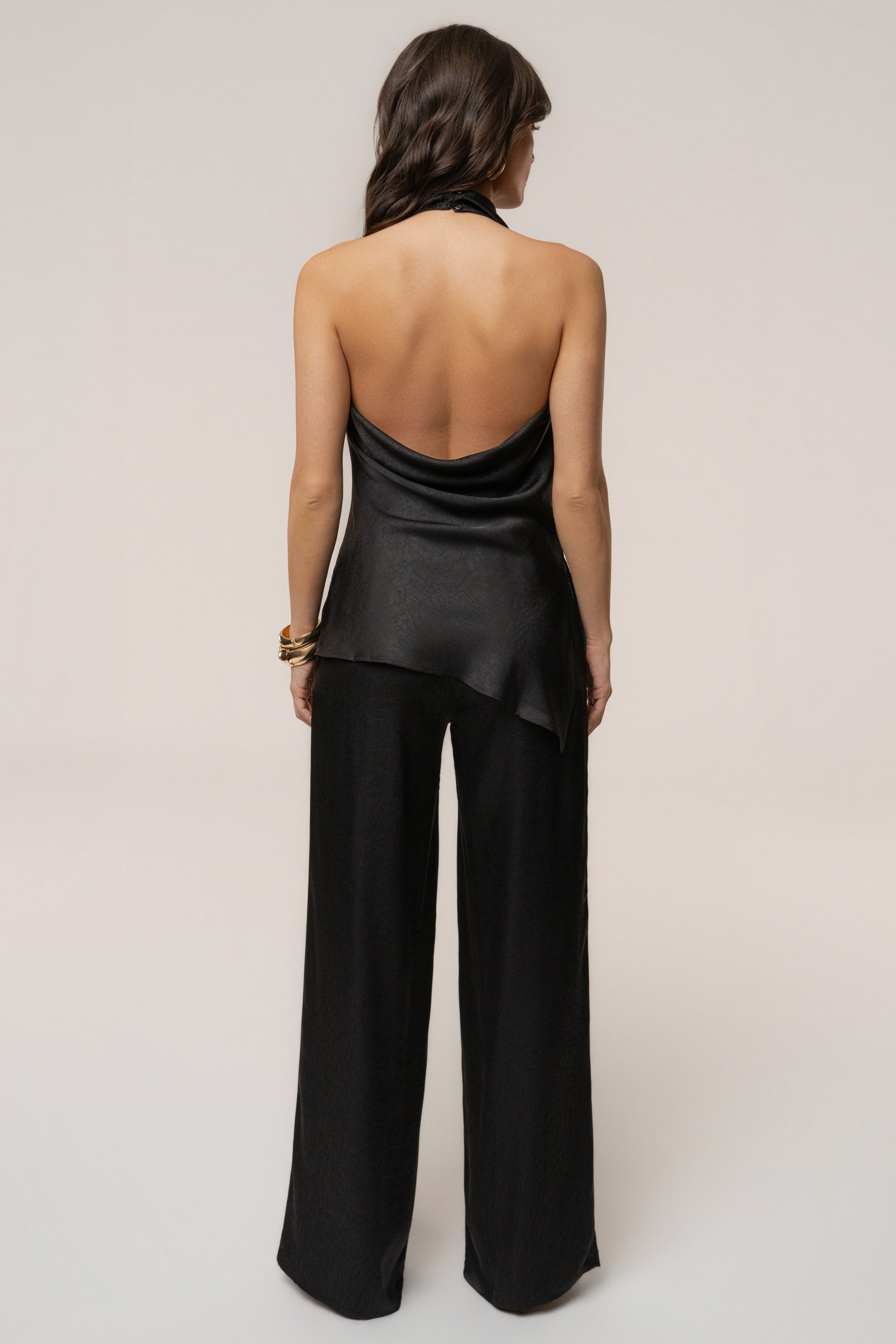Black satin pant set with draped design, featuring sleek, elegant styling from JLUXLABEL.