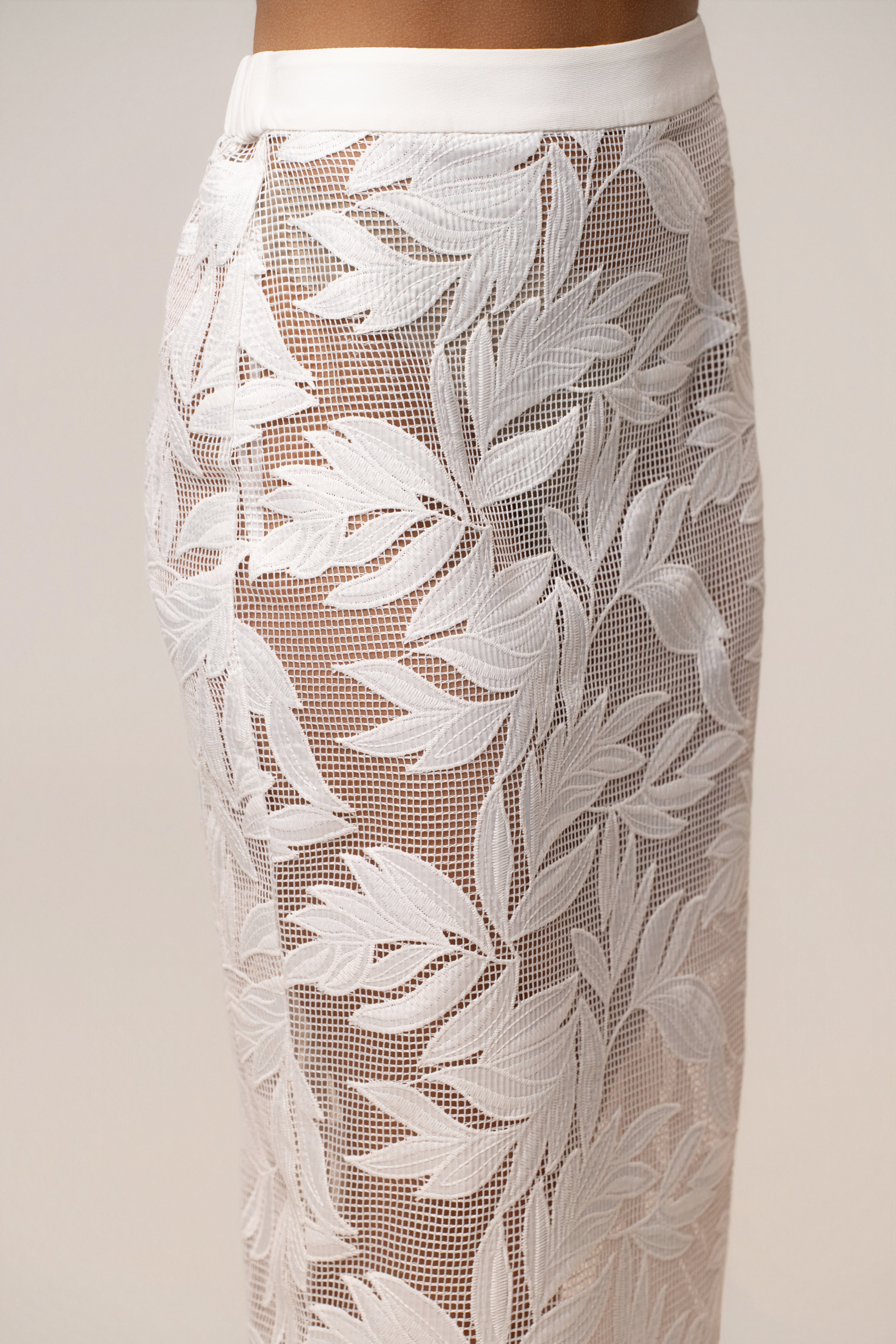 White Bali Nights embroidered skirt by JLUXLABEL, showcasing intricate embroidery and flowing fabric, perfect for summer wear.