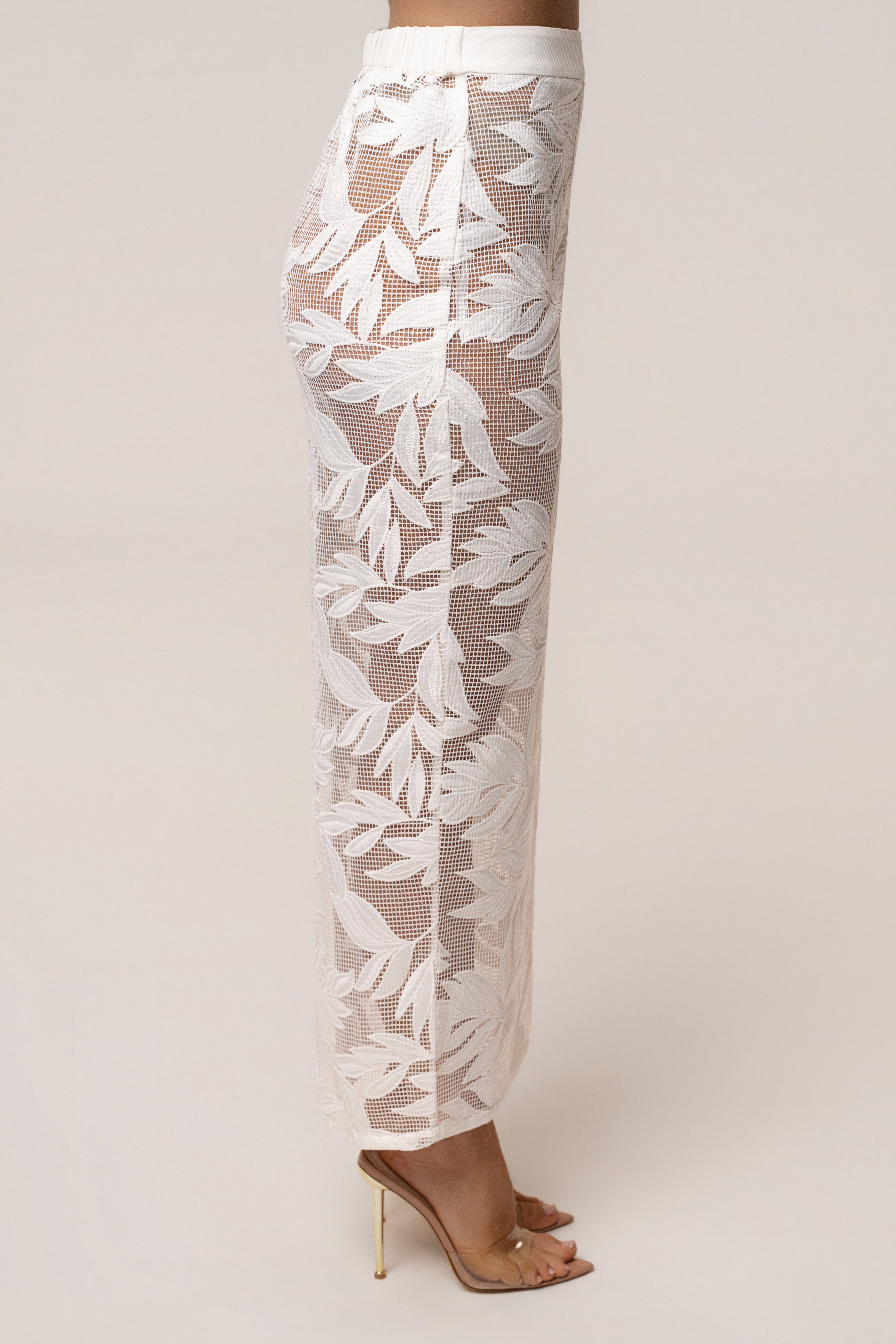 White Bali Nights embroidered skirt from JLUXLABEL, featuring intricate embroidery and flowing fabric, styled as a stylish bottom.