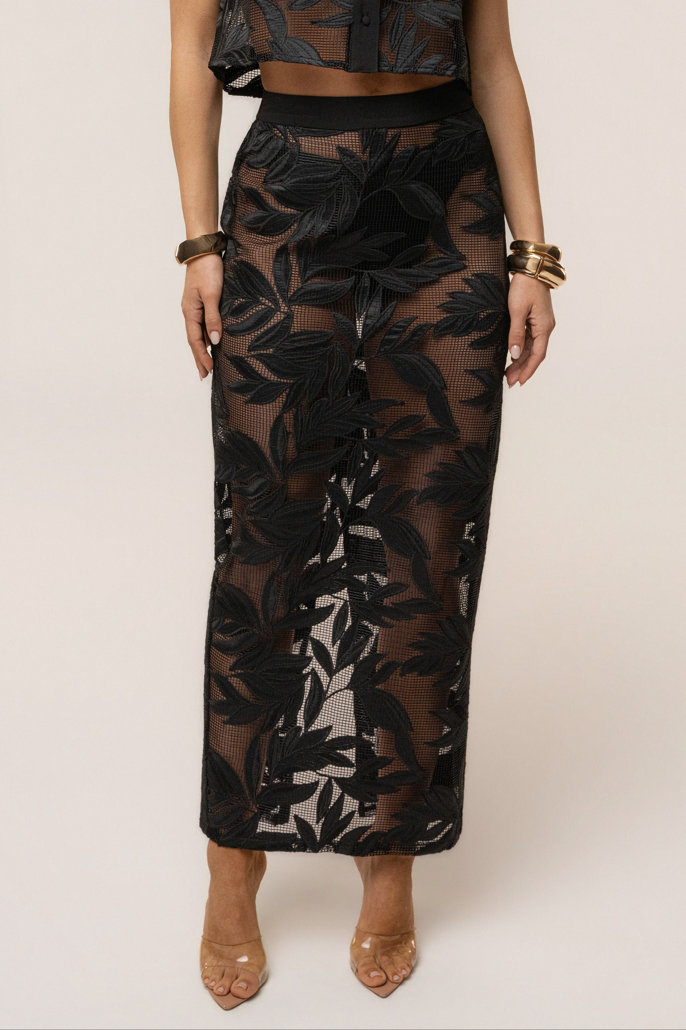 Black Bali Nights embroidered skirt from JLUXLABEL featuring intricate embroidery and flowing fabric, shown on a model.