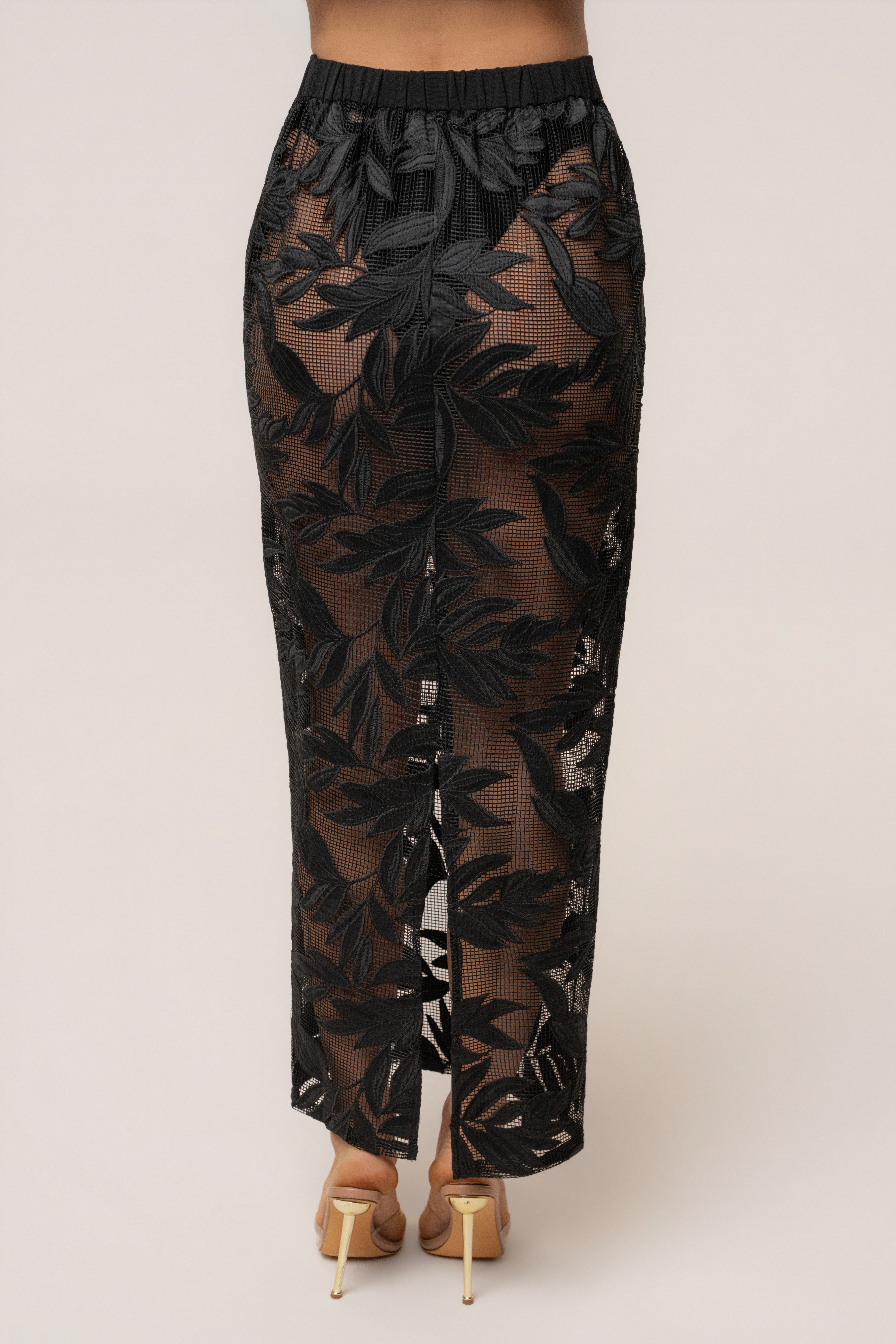 Black Bali Nights embroidered skirt by JLUXLABEL, showcasing intricate embroidery and flowy fabric, perfect for stylish bottoms.