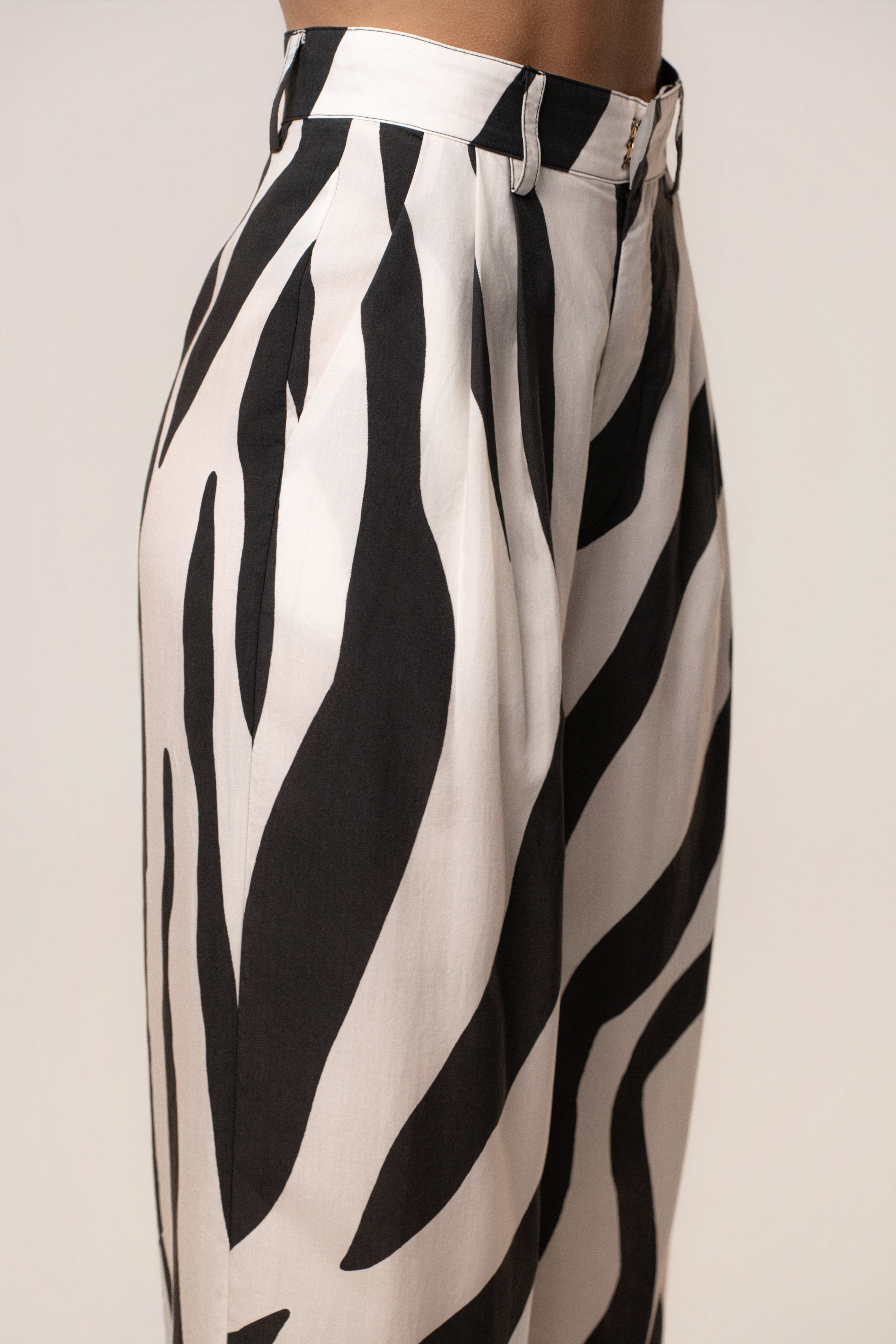 Zebra Essential Flow Trouser by JLUXLABEL, stylish black and white striped bottoms with a relaxed fit and tailored waistband.