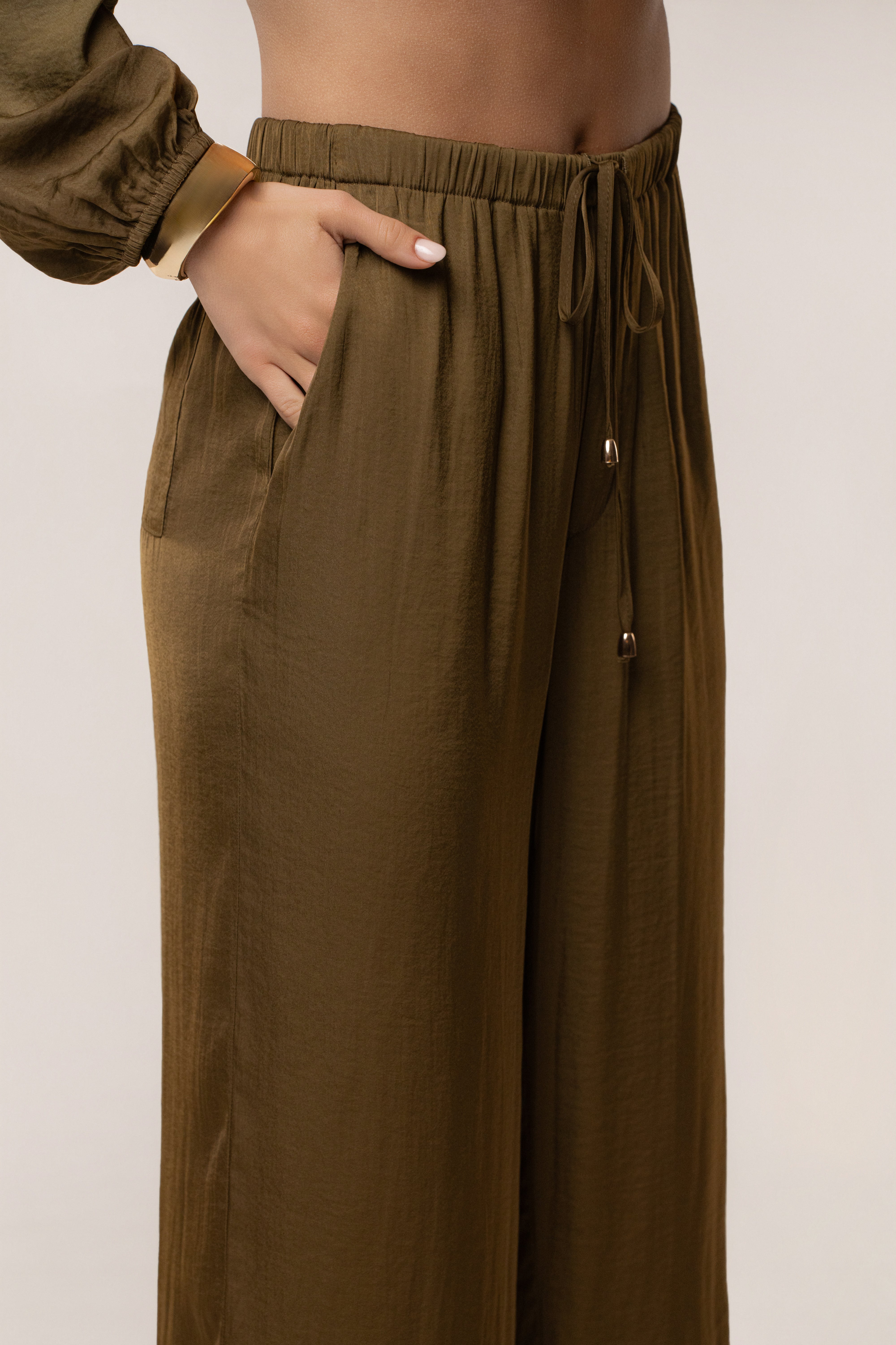 JLUXLABEL Olive Seaside Glow Pants, stylish olive-colored bottoms with a relaxed fit and seaside-inspired design.