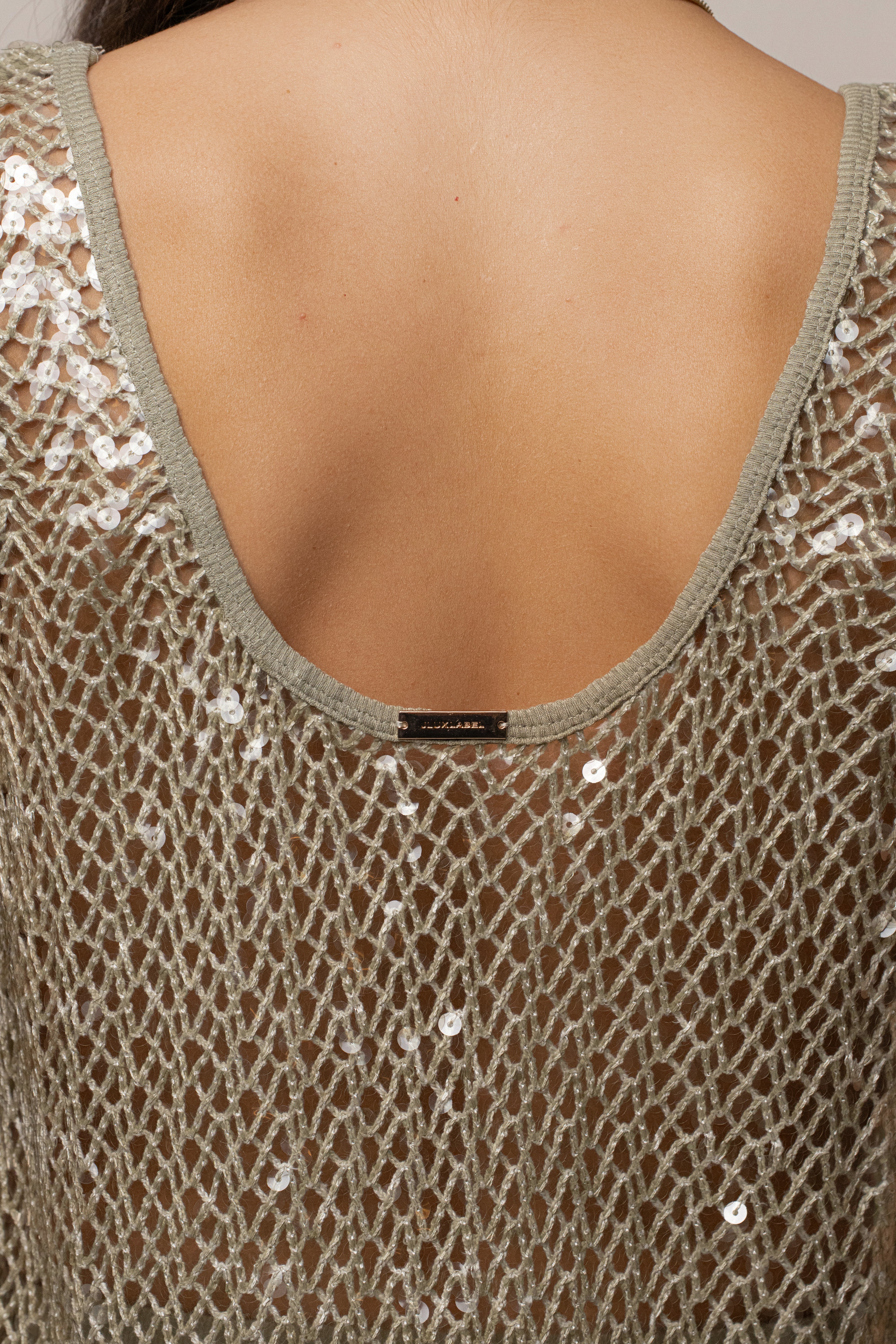JLUXLABEL Sage High Seas sequin top with long sleeves and shimmering embellishments, stylish women's top for festive occasions.