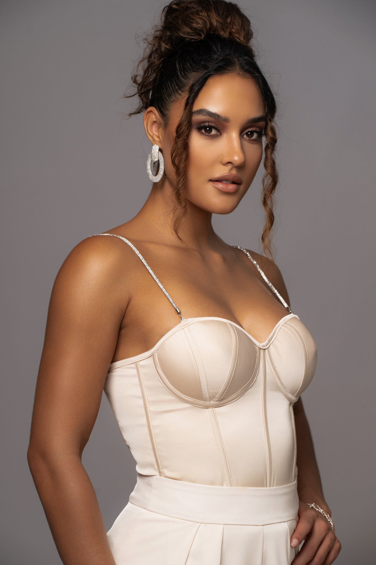 JLUXLABEL Champagne Leo matte satin bustier top, featuring a fitted design with elegant satin finish and structured bust detail.