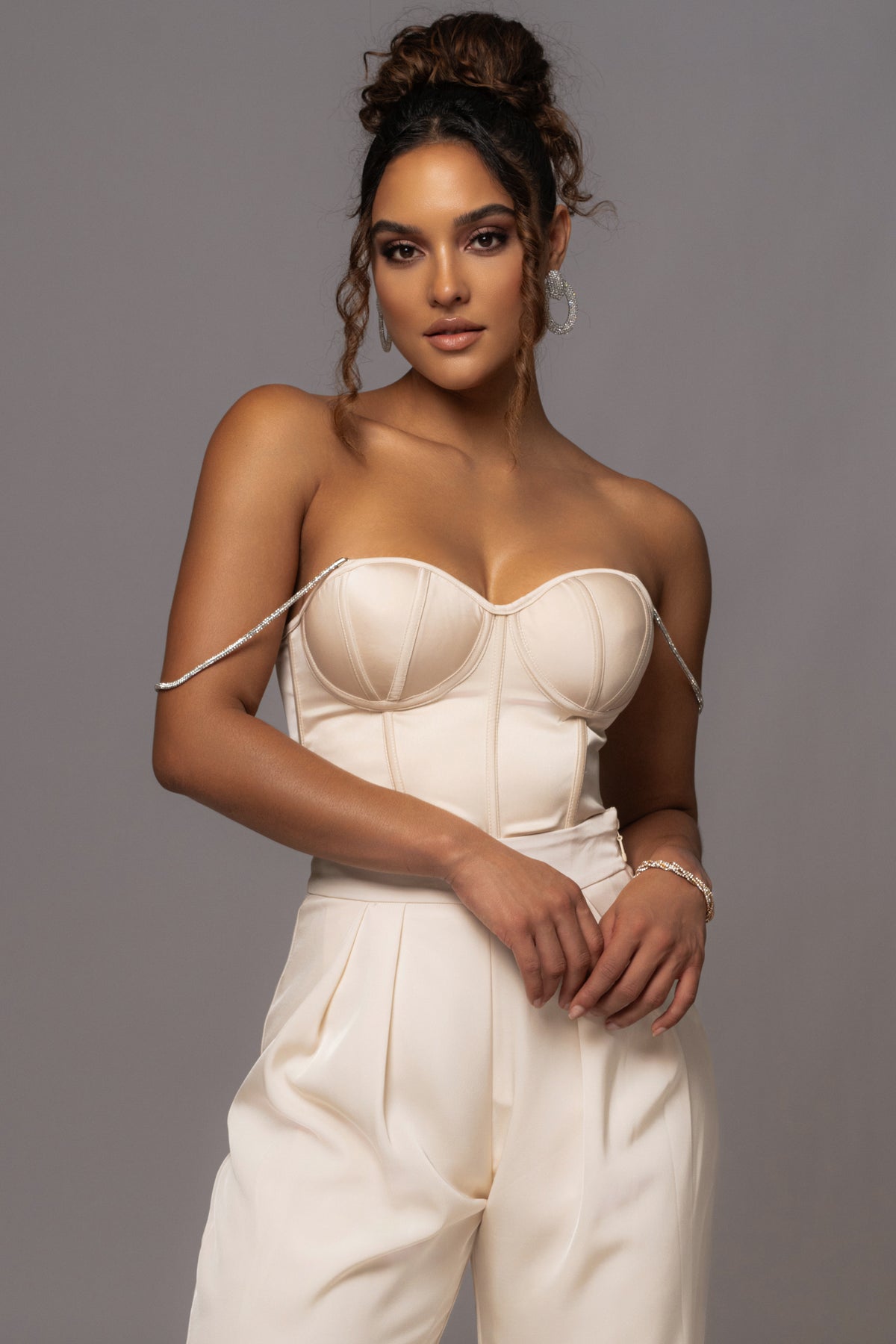 JLUXLABEL Champagne Leo matte satin bustier top with structured design and adjustable straps, shown on a model.