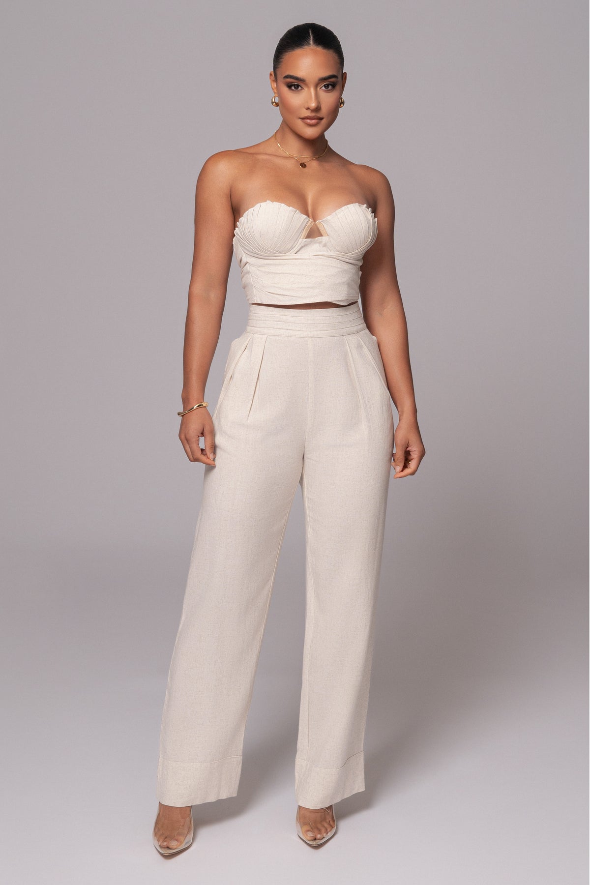 JLUXLABEL Natural Villa Views Linen Trousers, stylish beige bottoms with a relaxed fit and lightweight linen fabric.