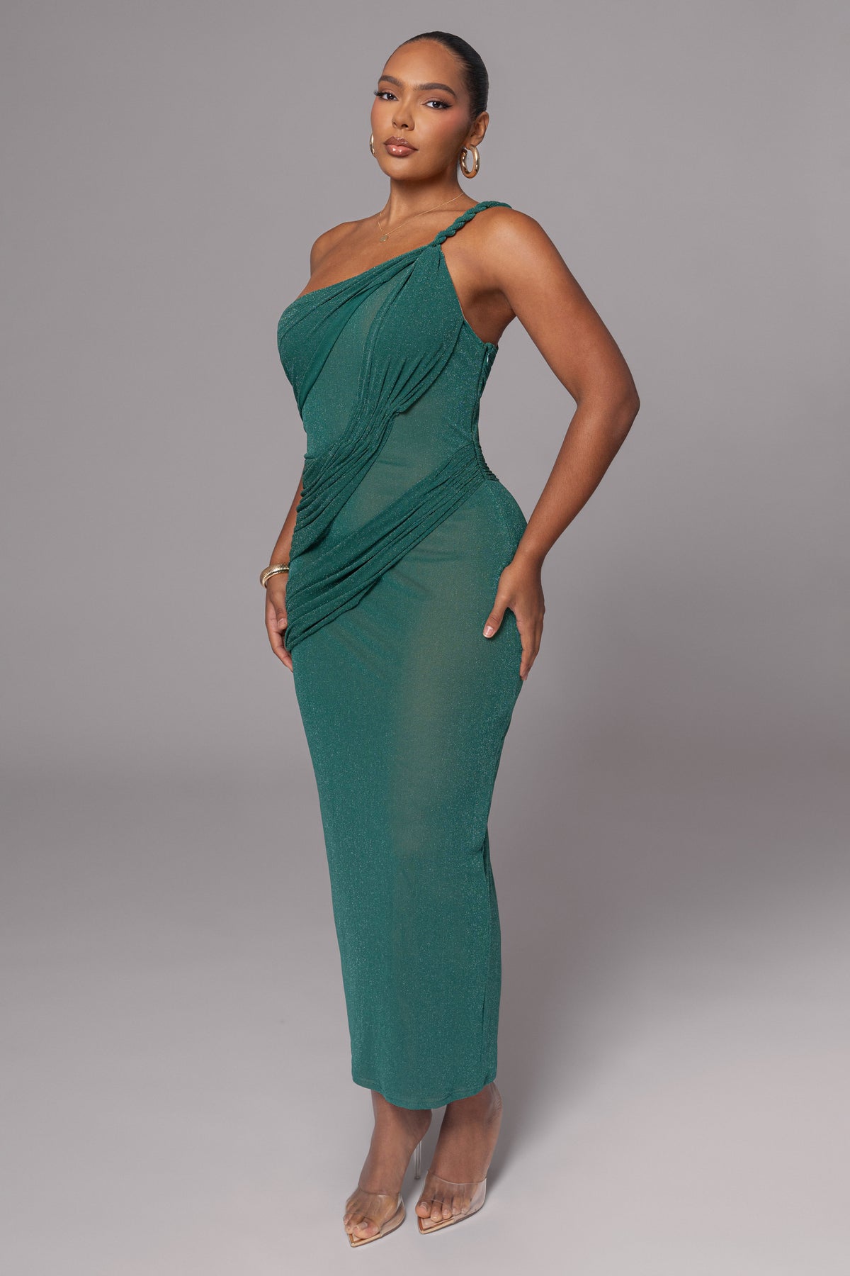 Green Alari one-shoulder maxi dress by JLUXLABEL featuring flowing fabric and elegant drape on a model.