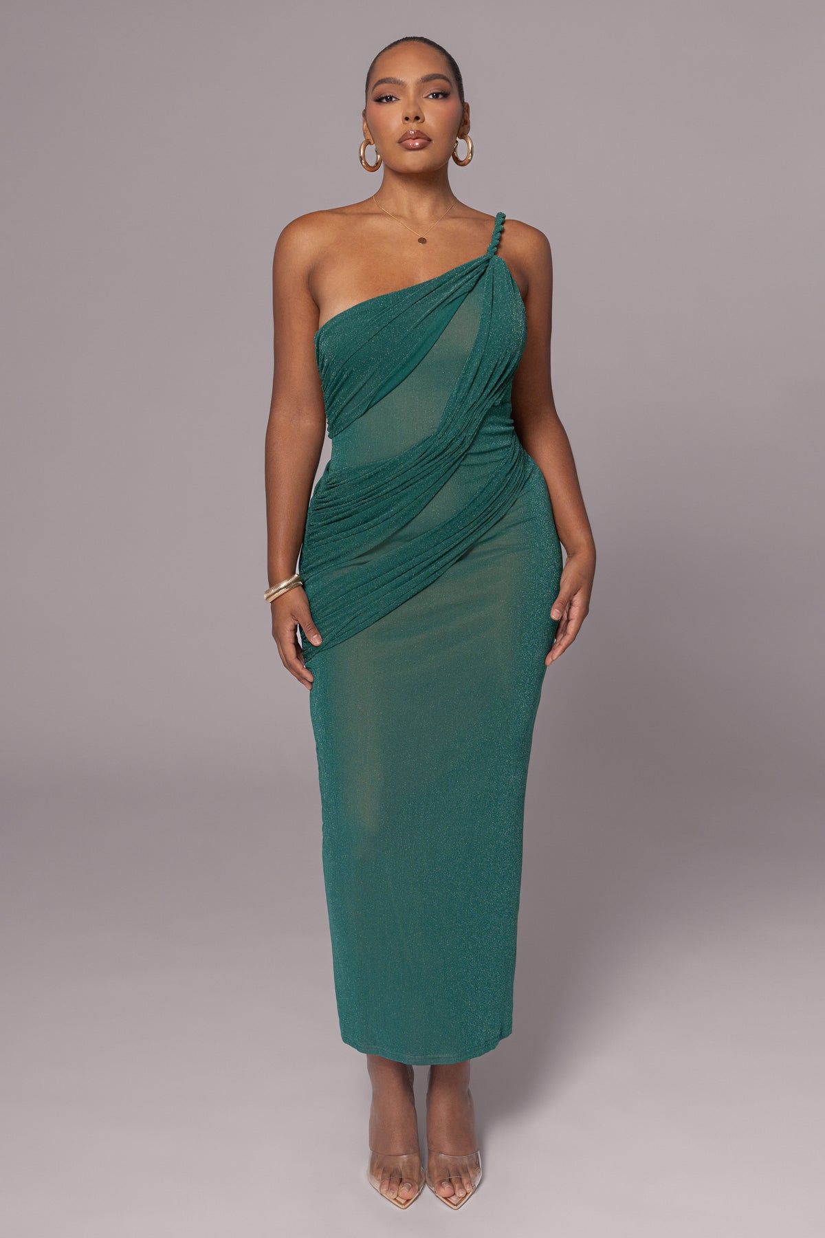 Green Alari one-shoulder maxi dress by JLUXLABEL, flowing fabric, elegant design, and single shoulder strap.