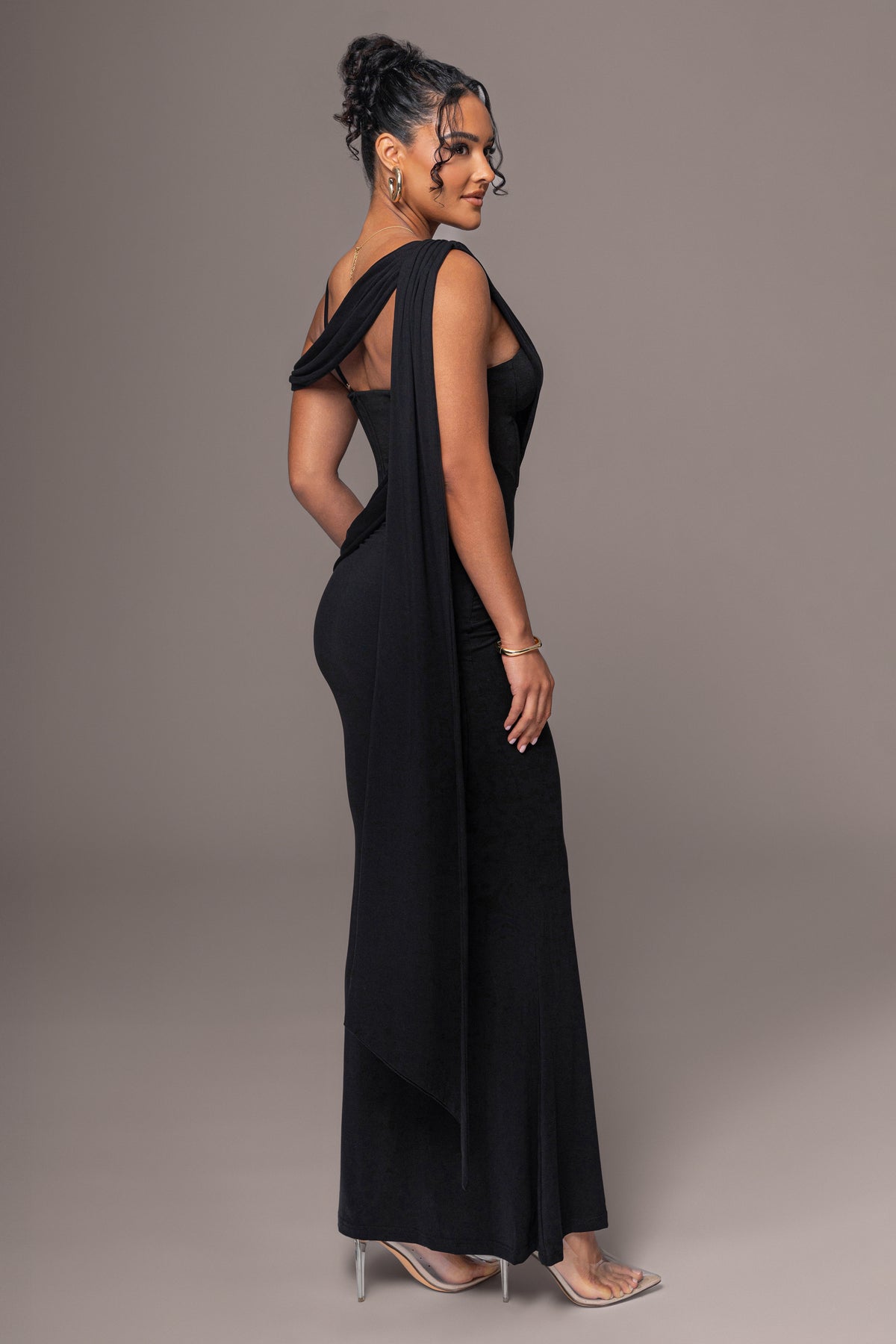 Black Grand Entrance Drape Dress by JLUXLABEL featuring elegant draped fabric and a stylish evening dress silhouette.