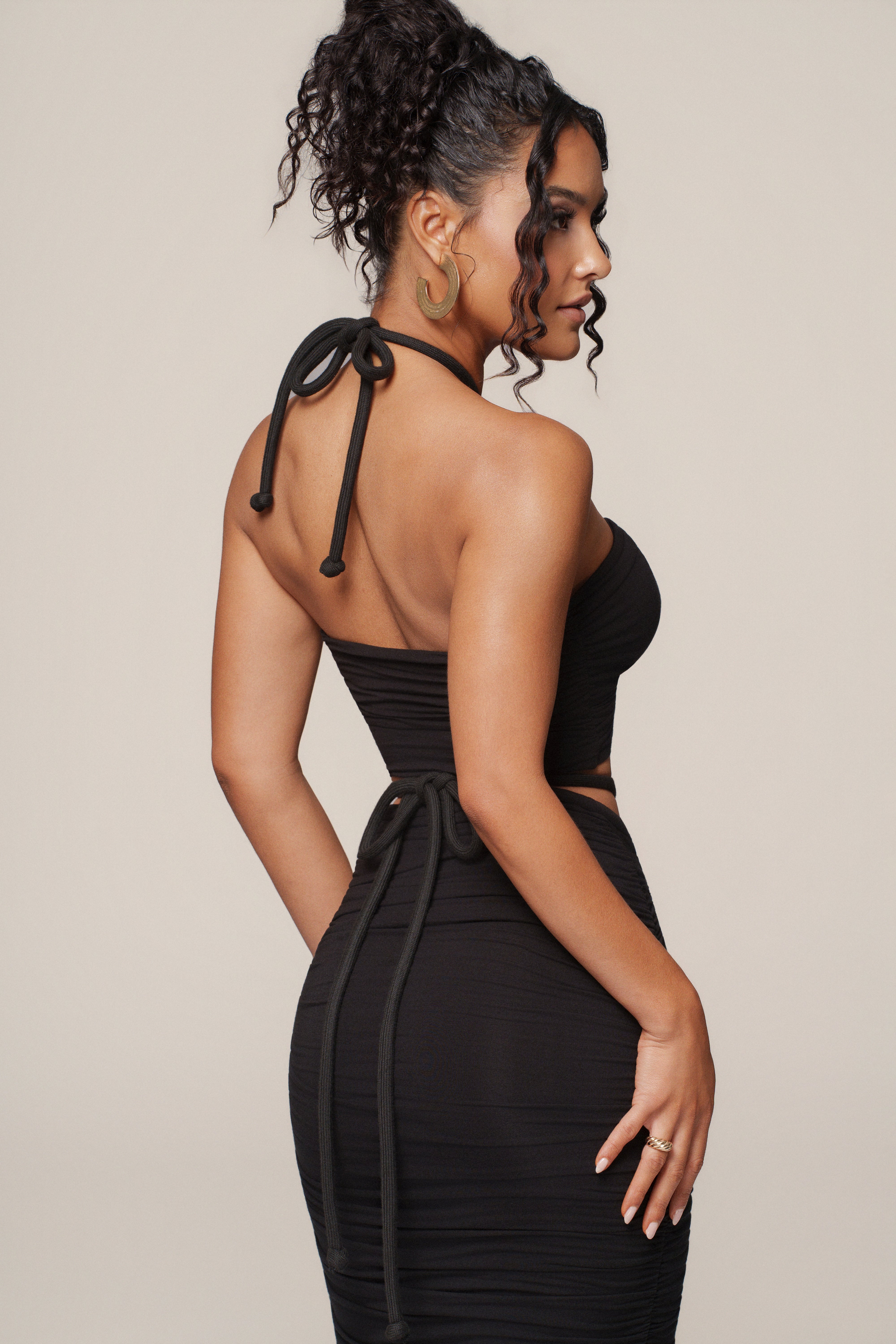 Black Go The Distance Skirt Set by JLUXLABEL, featuring a stylish matching top and skirt ensemble on a model.