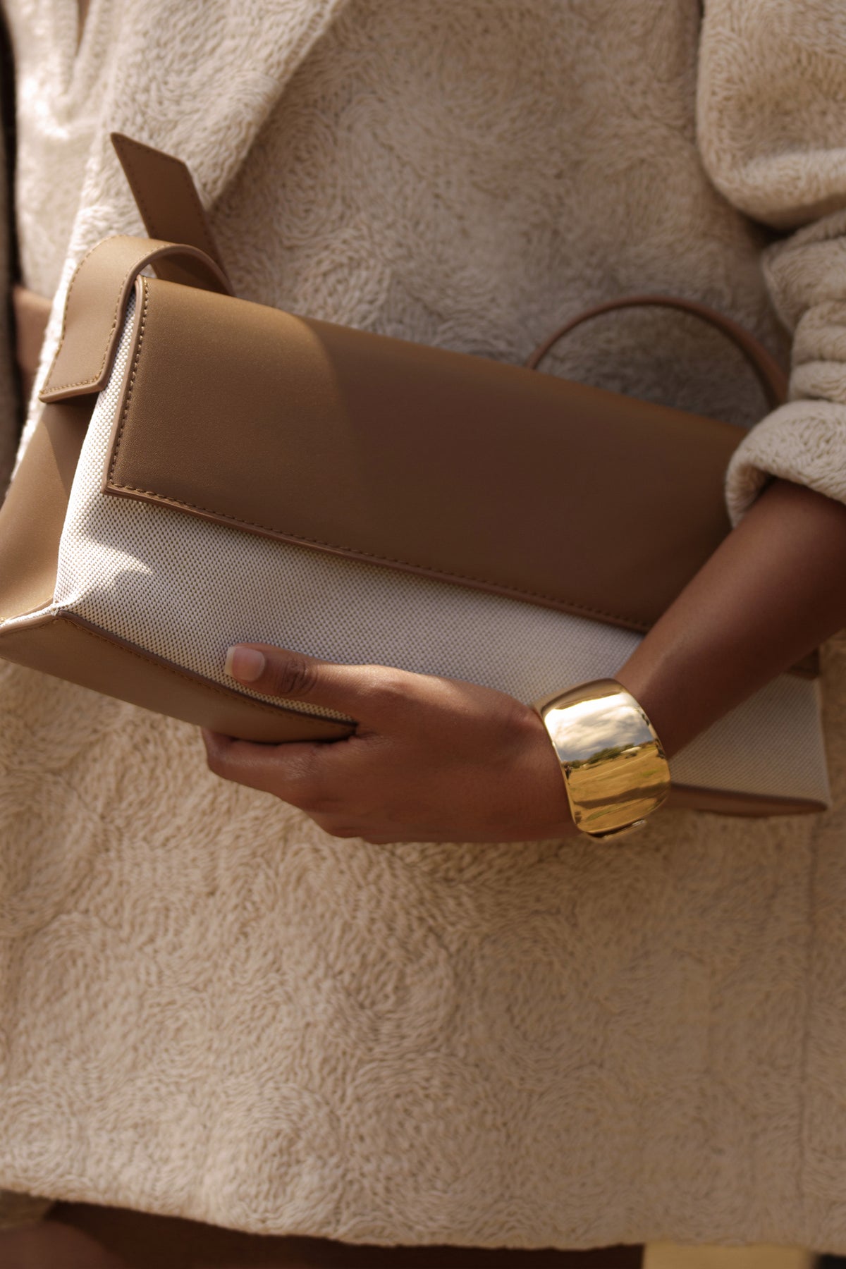 Beige JLUXLABEL Hudson shoulder bag with adjustable strap and gold-tone hardware, stylish accessory for everyday wear.