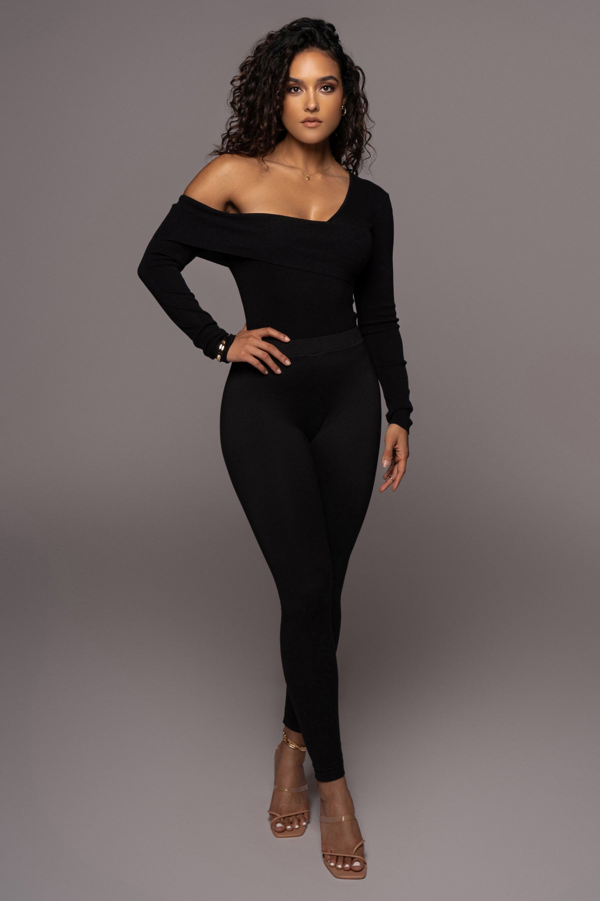 Black Eve off-the-shoulder top by JLUXLABEL featuring a stylish neckline and fitted design, displayed on a white background.
