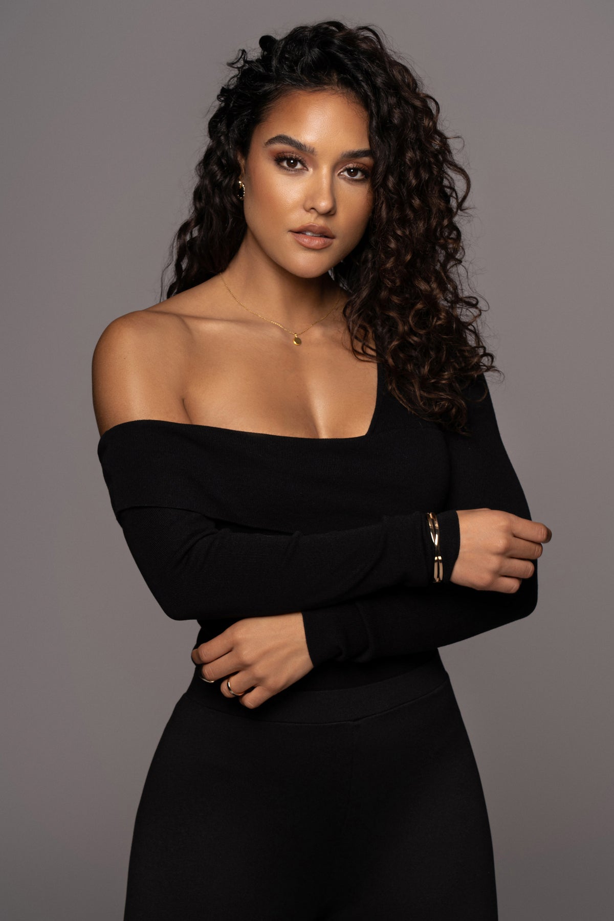Black Eve off-the-shoulder top from JLUXLABEL featuring a stylish neckline and long sleeves, perfect for casual or dressy occasions.