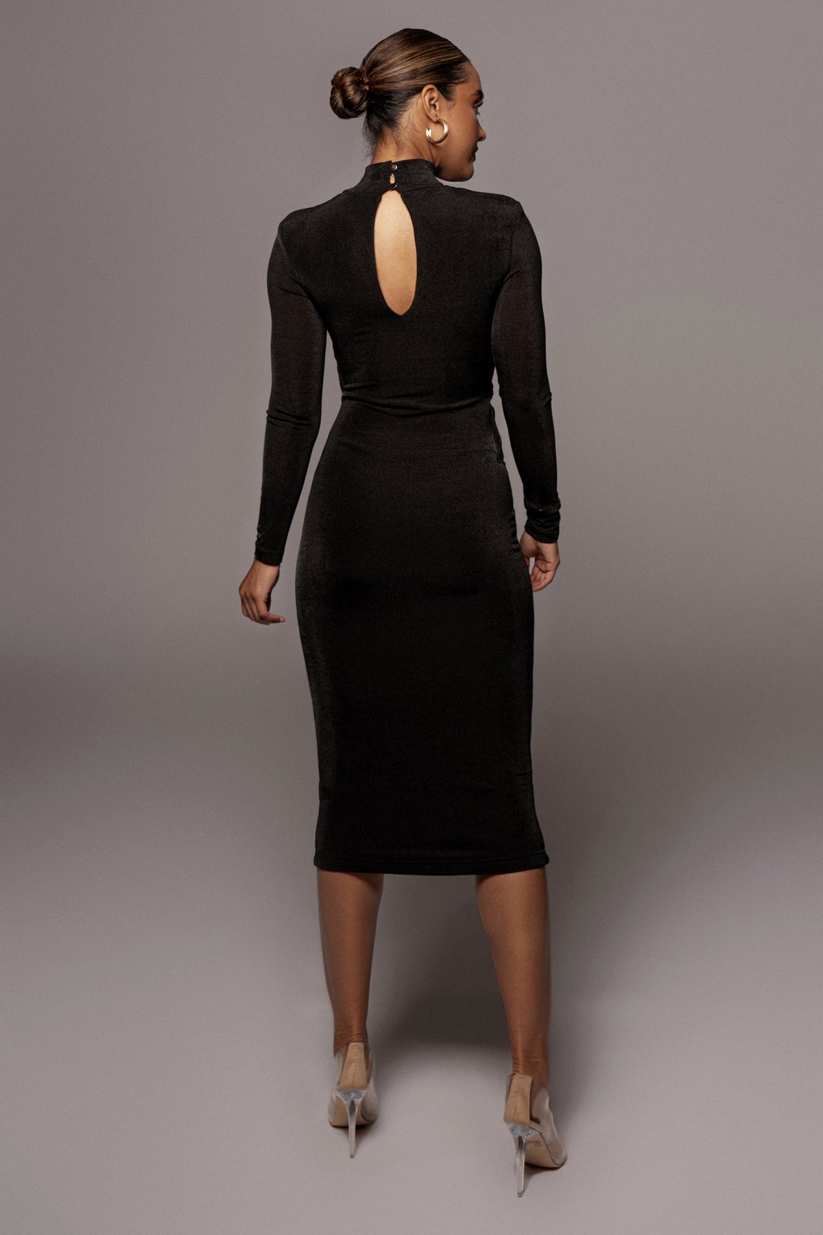 Black Kara mock neck dress by JLUXLABEL, featuring a fitted silhouette and long sleeves, perfect for elegant occasions.
