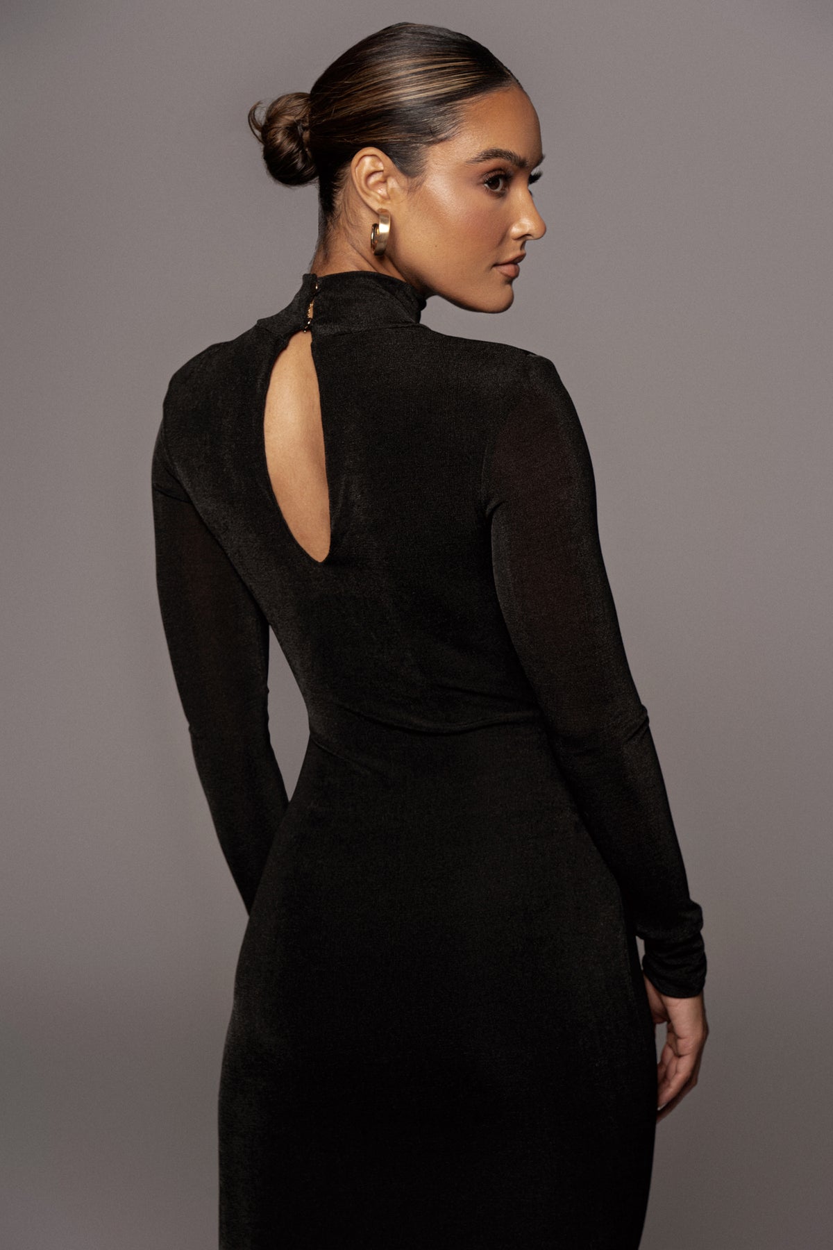 Black Kara mock neck dress by JLUXLABEL, featuring a fitted silhouette and long sleeves, perfect for stylish occasions.