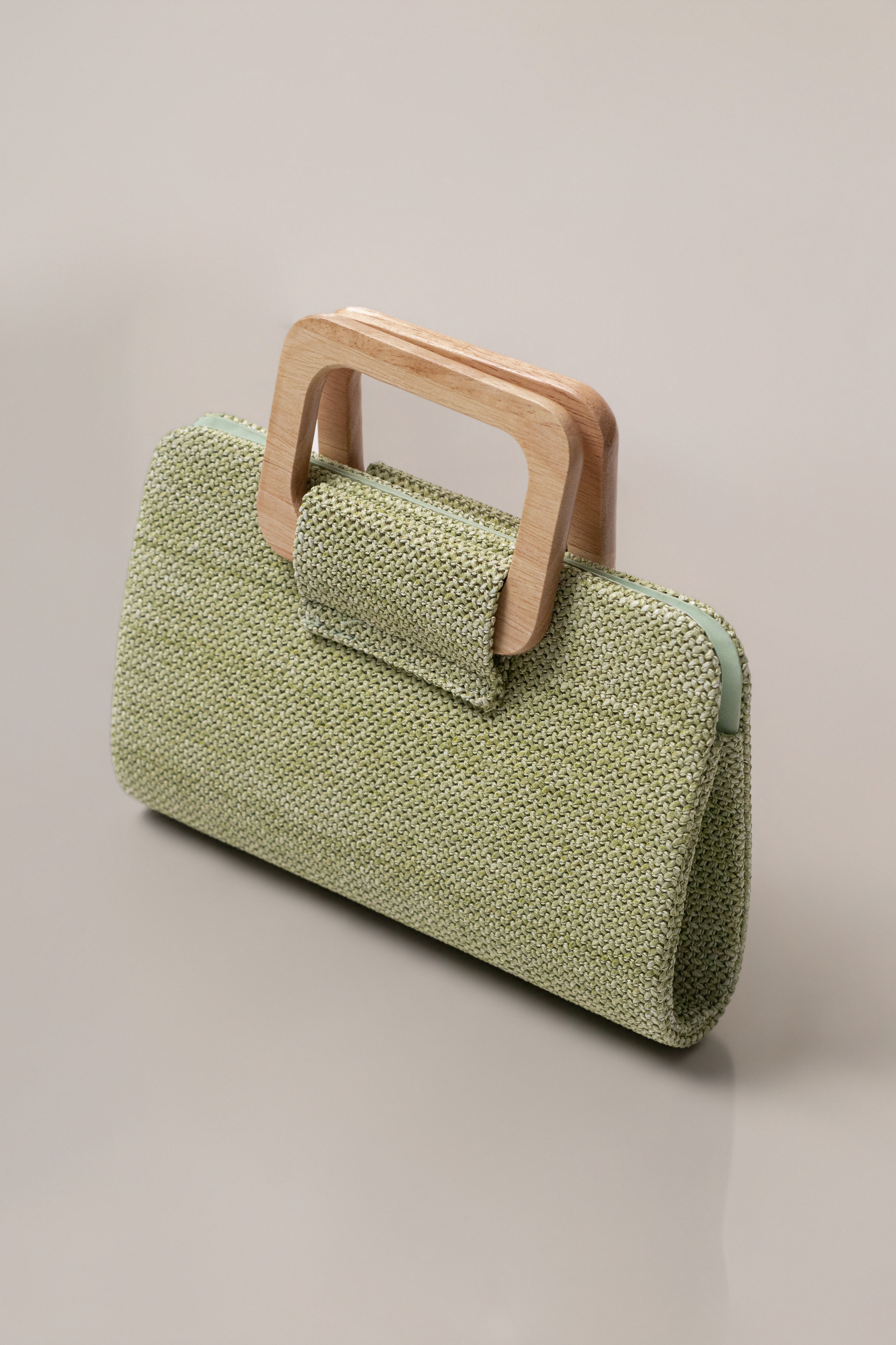 Sage Isola Clutch by JLUXLABEL, stylish accessories bag with textured fabric and elegant design, perfect for evening outings.