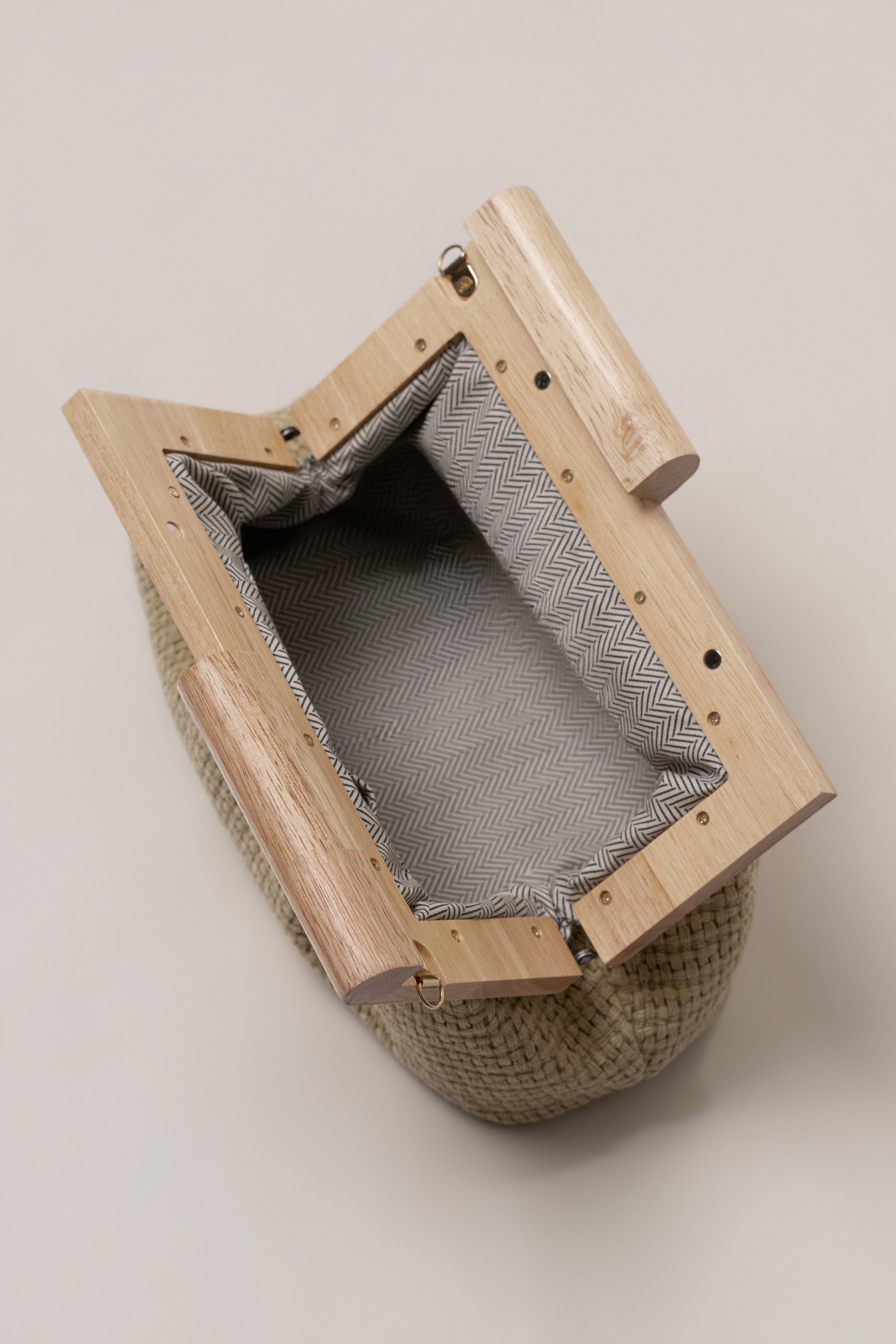 JLUXLABEL Natural Mykonos clutch bag with woven design, perfect as a stylish accessories piece for elegant occasions.