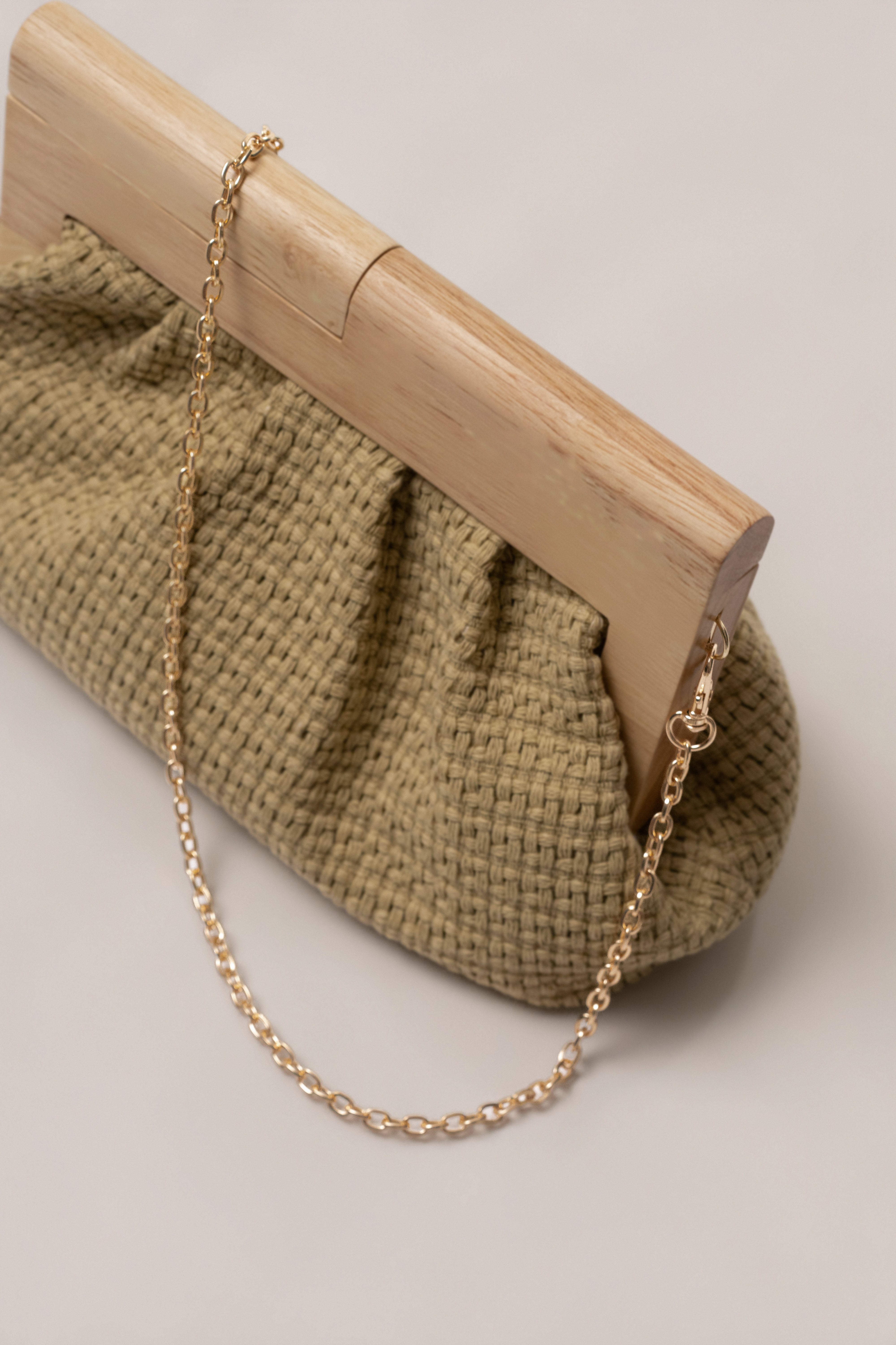 Natural Mykonos clutch bag by JLUXLABEL showing a stylish woven accessory with leather accents for elegant occasions.