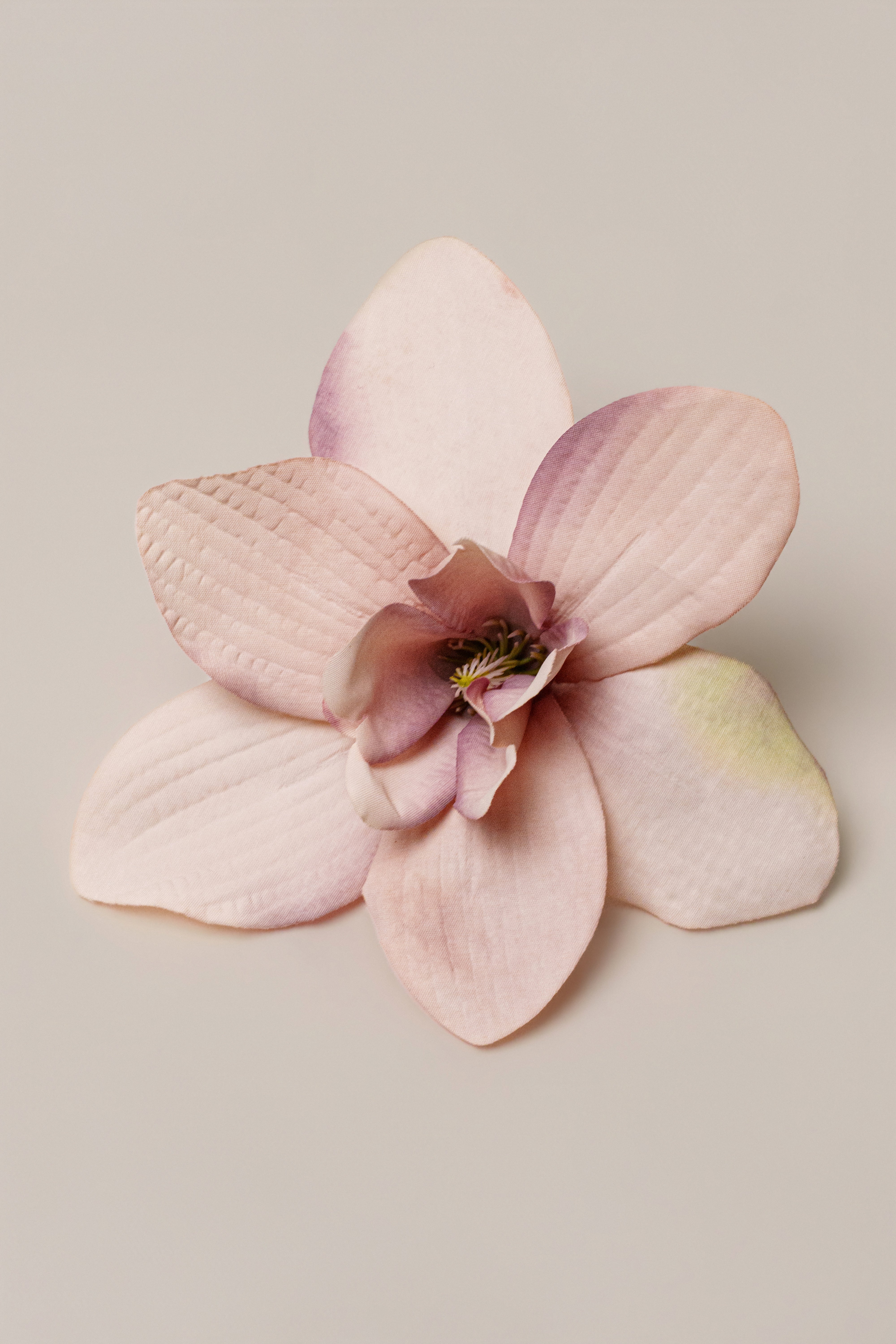 Pink Coastal Orchid hair clip from JLUXLABEL, decorative accessory with floral design for stylish hair embellishment.