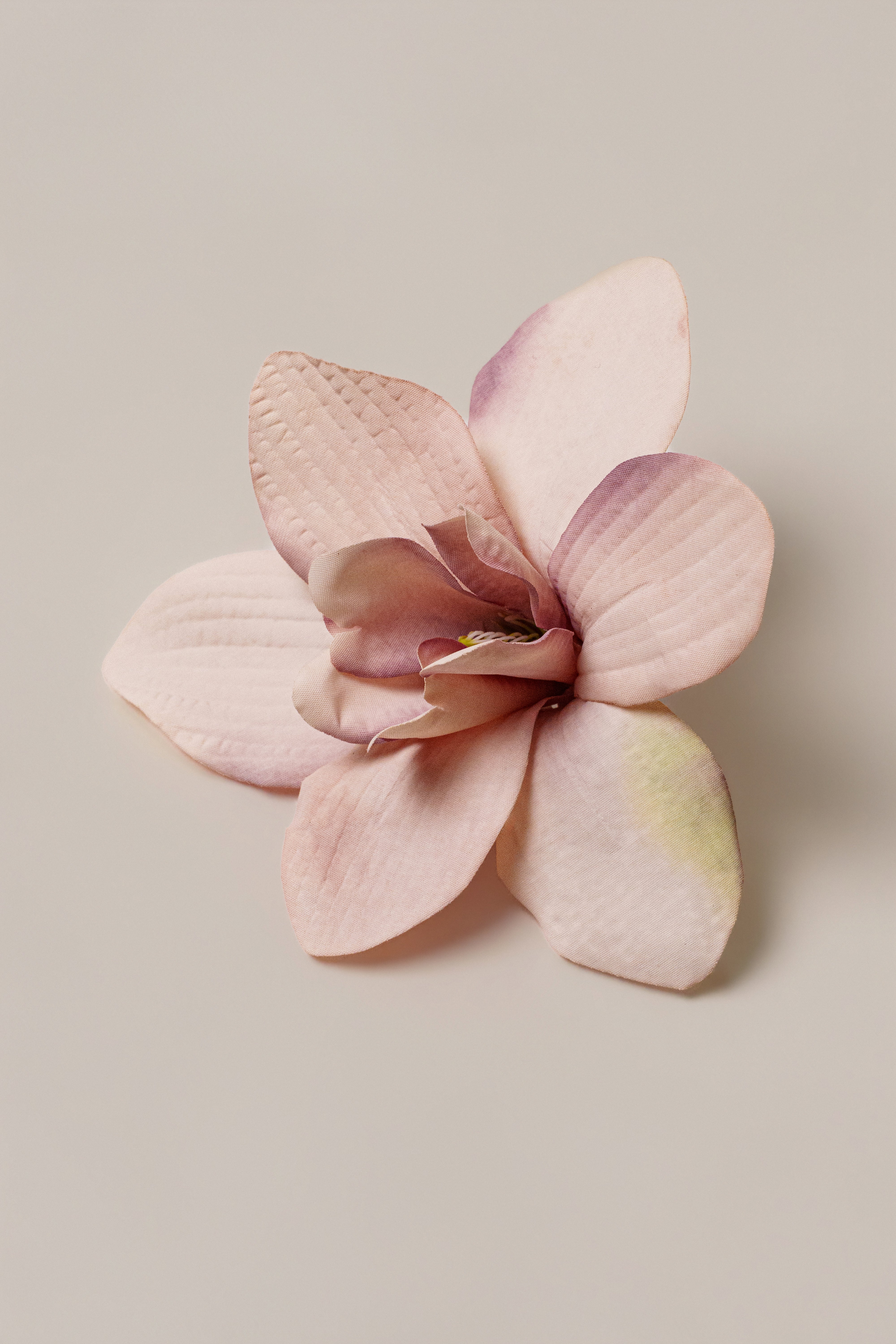 Pink coastal orchid hair clip from JLUXLABEL, an elegant accessory with floral design, showcased on a neutral background.